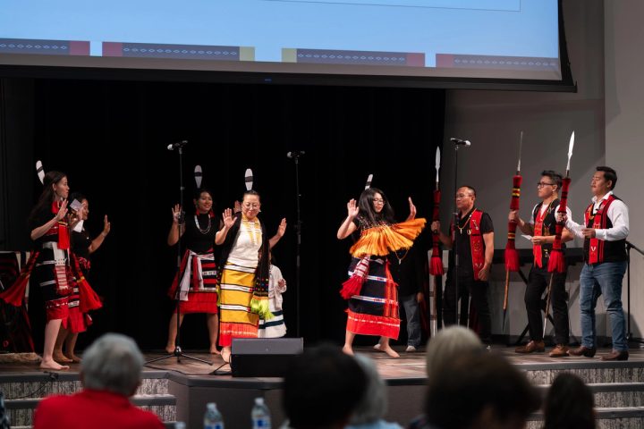 Photograph of a group of performers presenting on stage at the First Naga Baptist Fundraising Cultural Event.