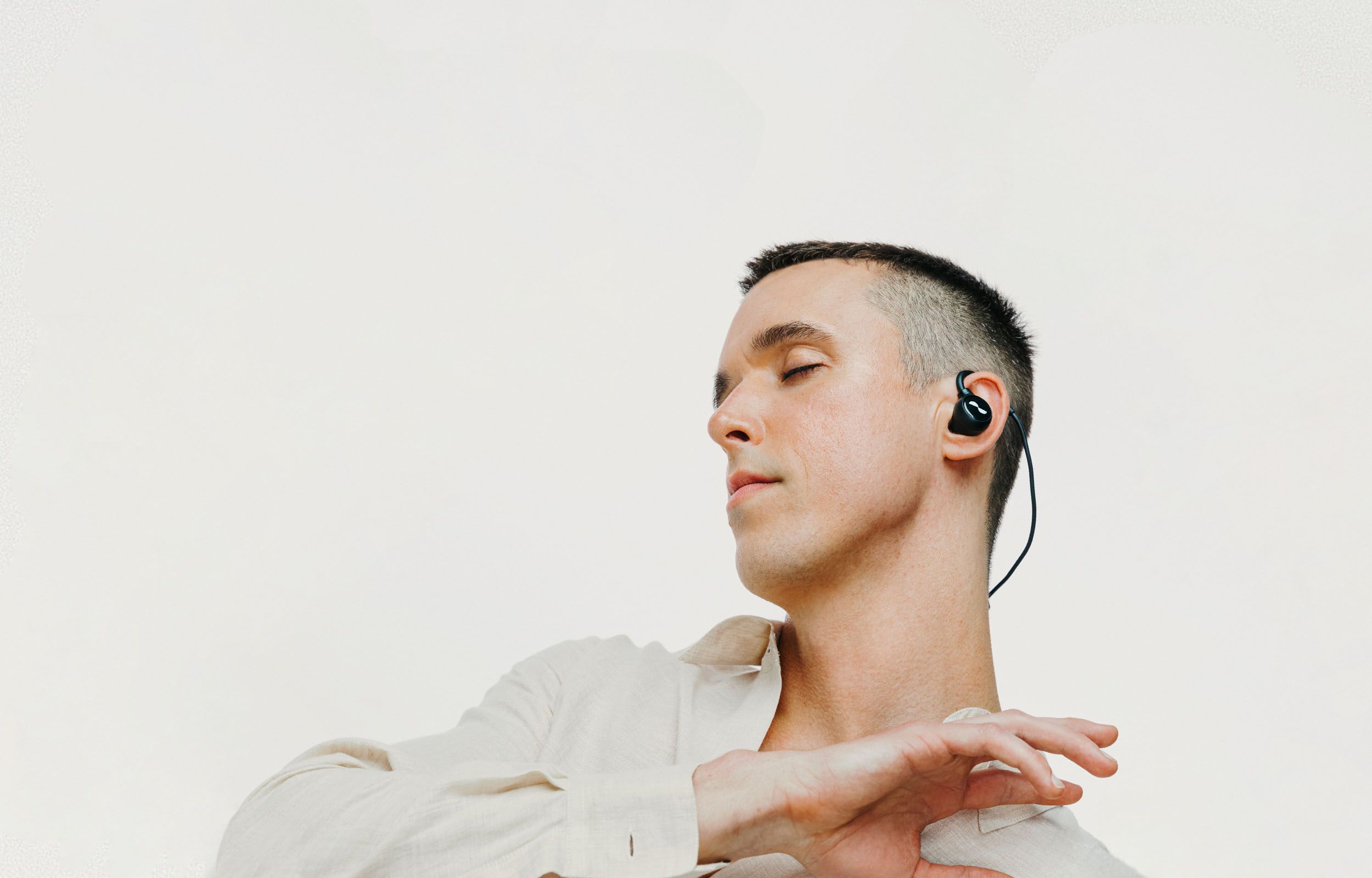 Person dancing with NURALOOP earbuds in ears