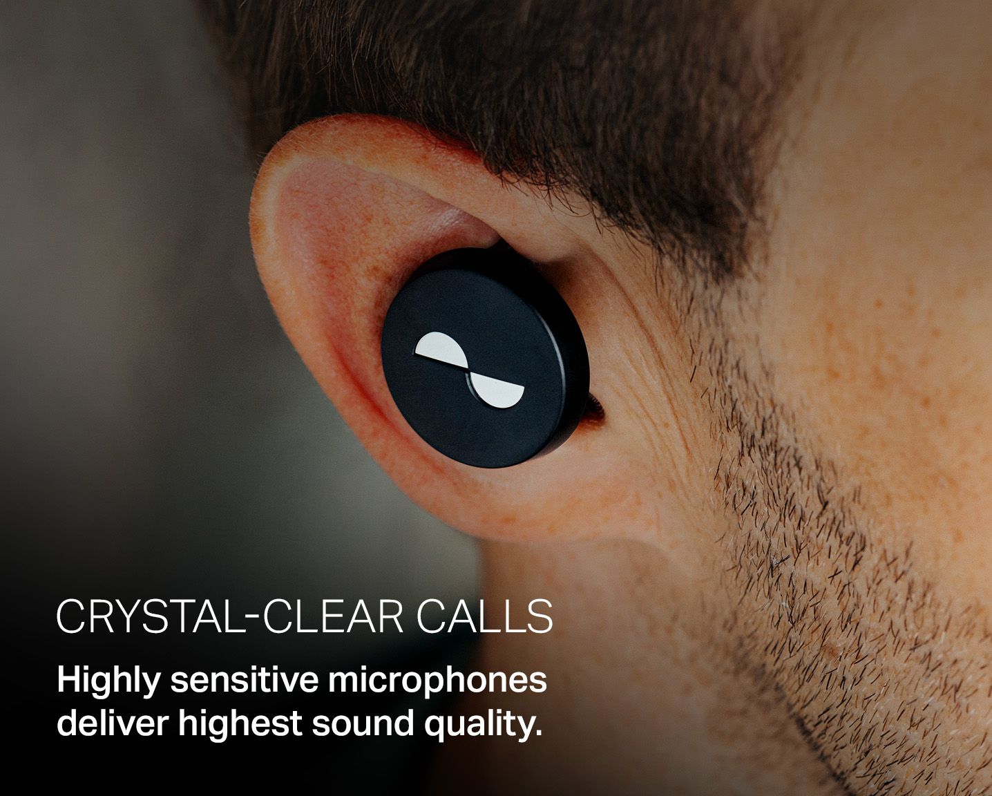 Close-up shot of the NURATRUE earbuds in an ear, with overlay text: "Crystal-clear calls. Highly sensitive microphones deliver highest sound quality."