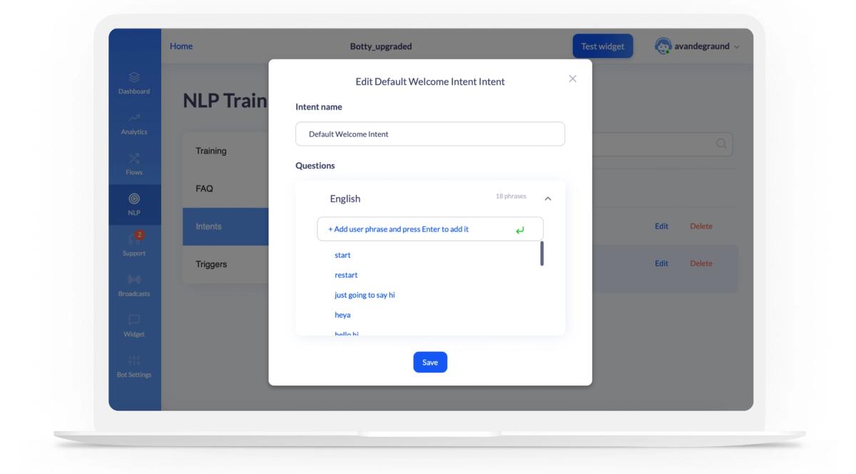 The BotsCrew platform's Intents screen with an “Edit Default Welcome Intent Intent” dialog open: an Intent name field reading Default Welcome Intent, and a Questions panel listing the English phrases already trained — start, restart, just going to say hi, heya, hello hi — with an “Add user phrase and press Enter to add it” field and a Save button