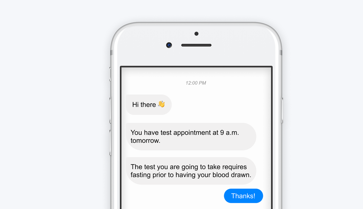 A phone chat in which a reminder bot writes “Hi there 👋”, “You have test appointment at 9 a.m. tomorrow.” and “The test you are going to take requires fasting prior to having your blood drawn.”, and the patient replies “Thanks!”