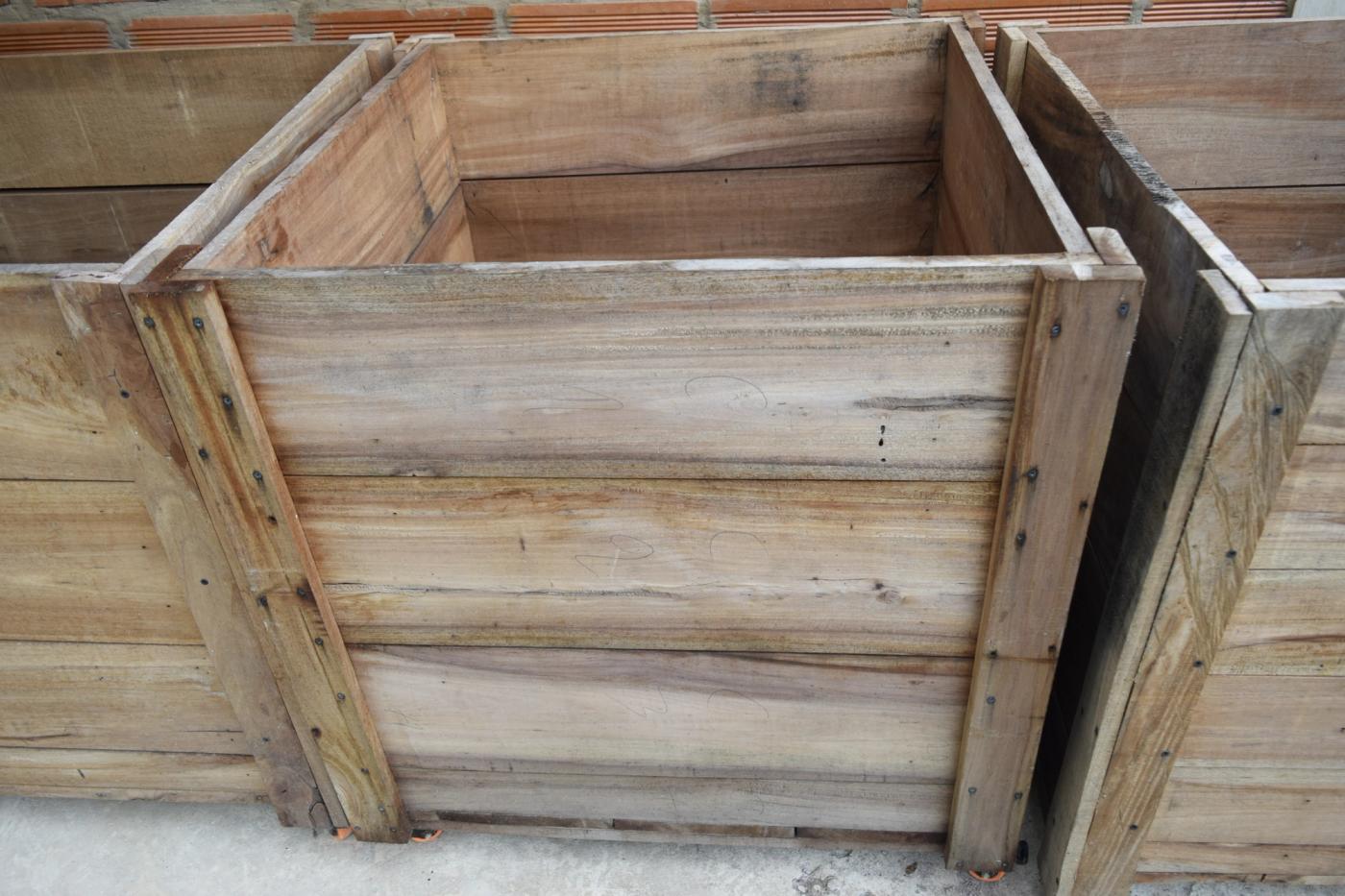 Wooden cacao fermentation boxes designed for heat retention and controlled airflow.