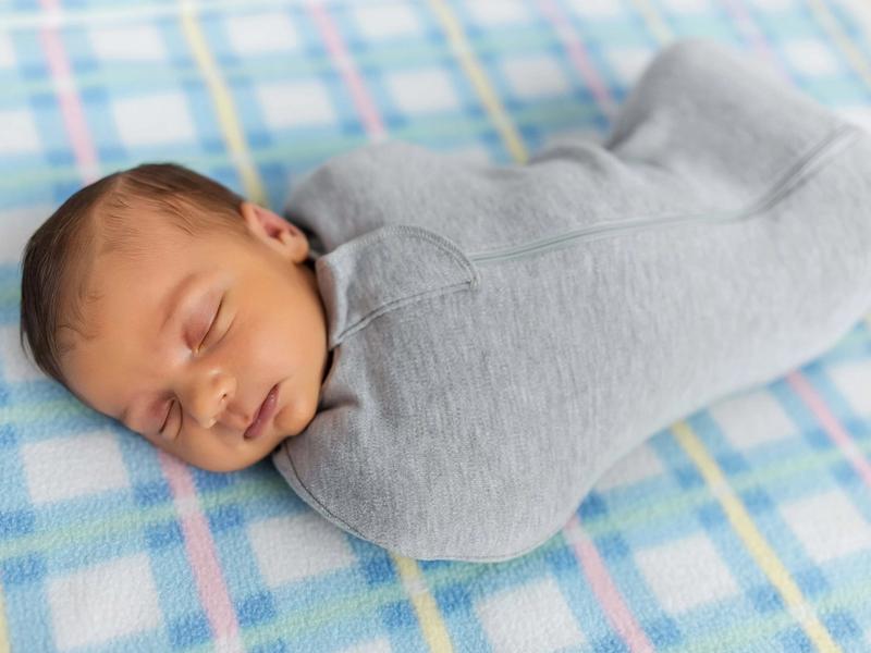 Swaddles versus sleep sacks: a guide to usage and safe transitions