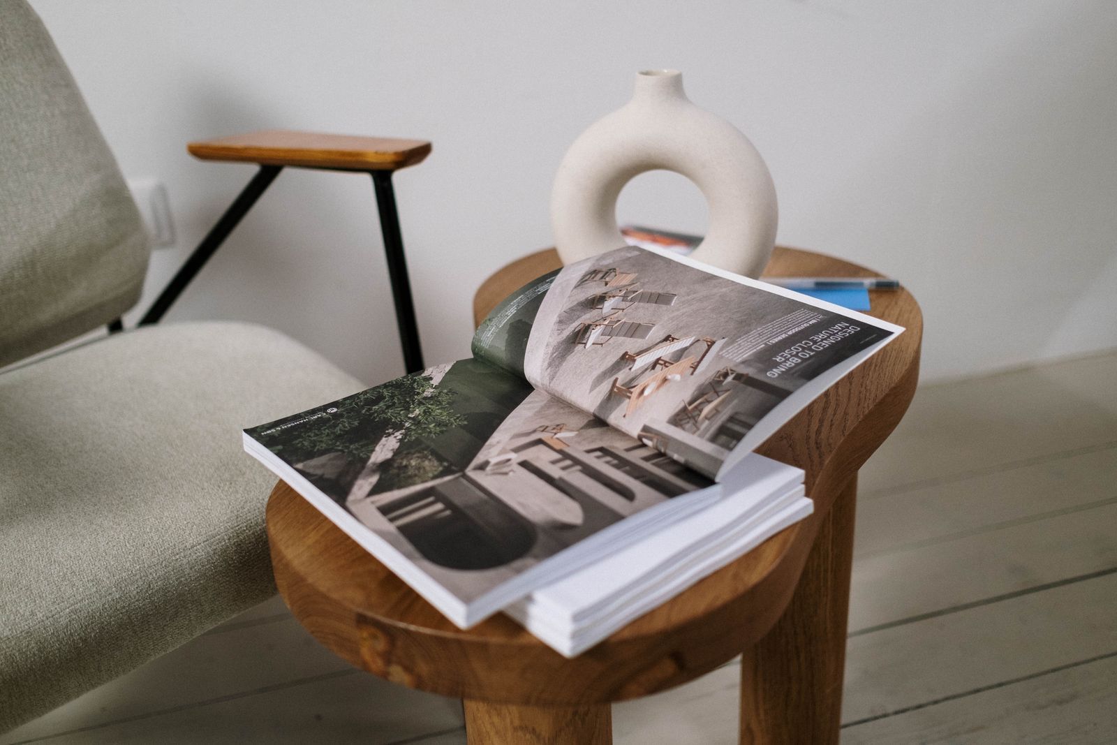 An open editorial publication with considered photographic layouts in a quiet reading space