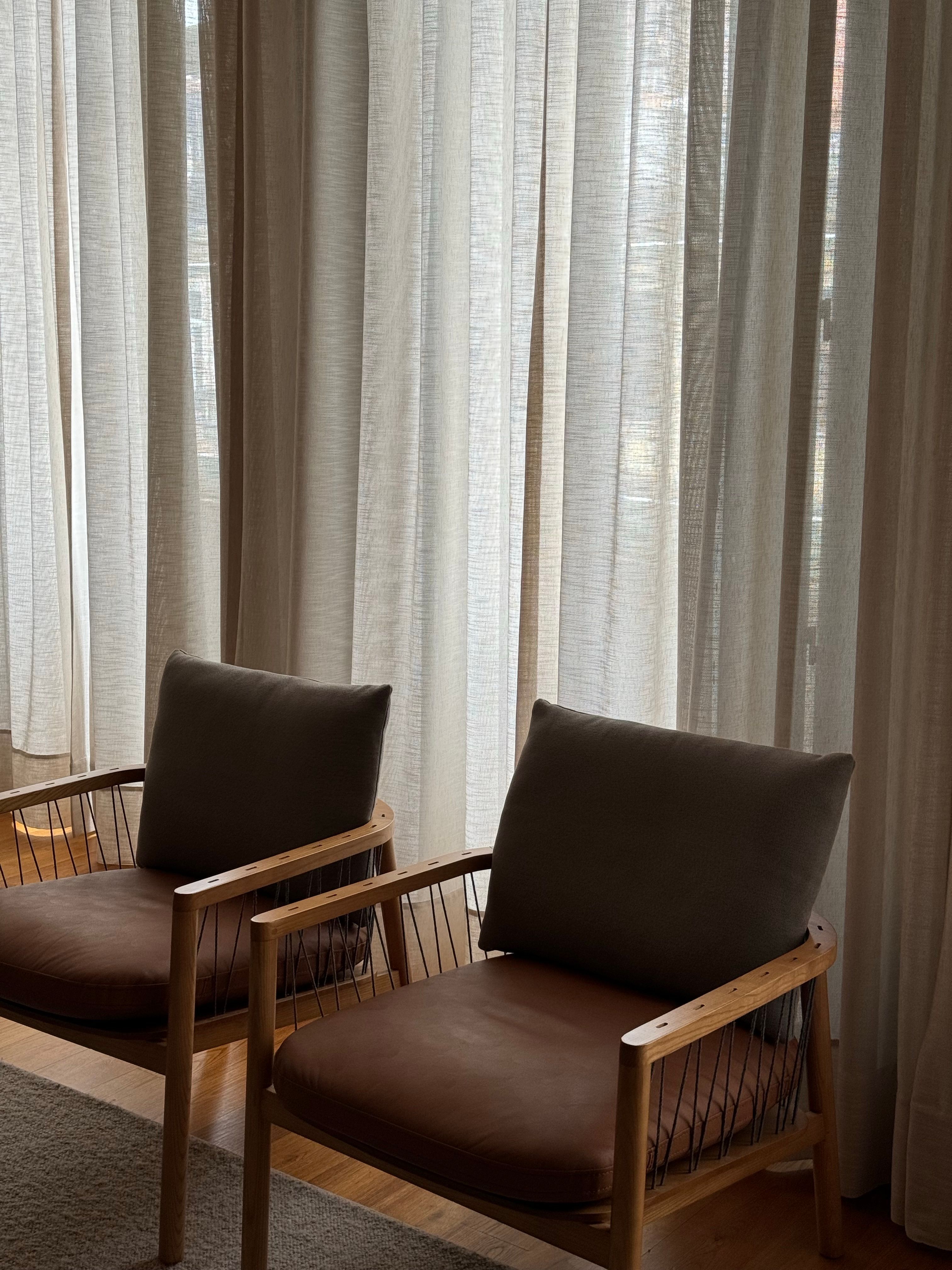 Chairs beside a sunlit window