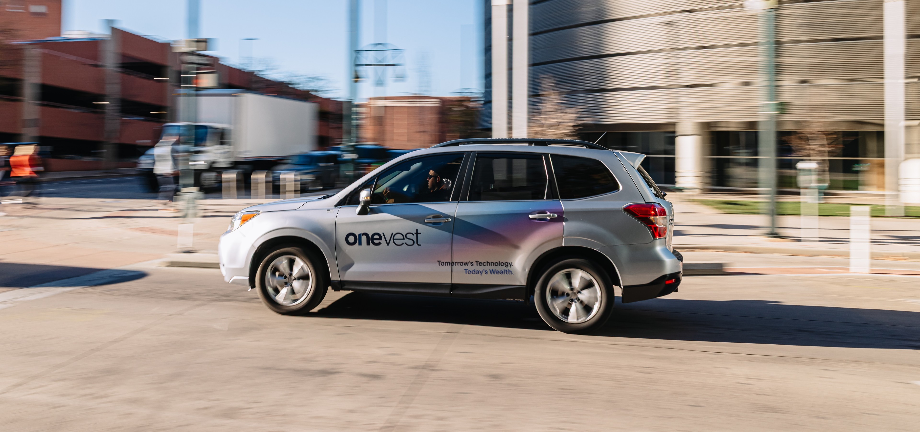 OneVest wrapped car OOH campaign in Denver via GOOD TRAFFIC
