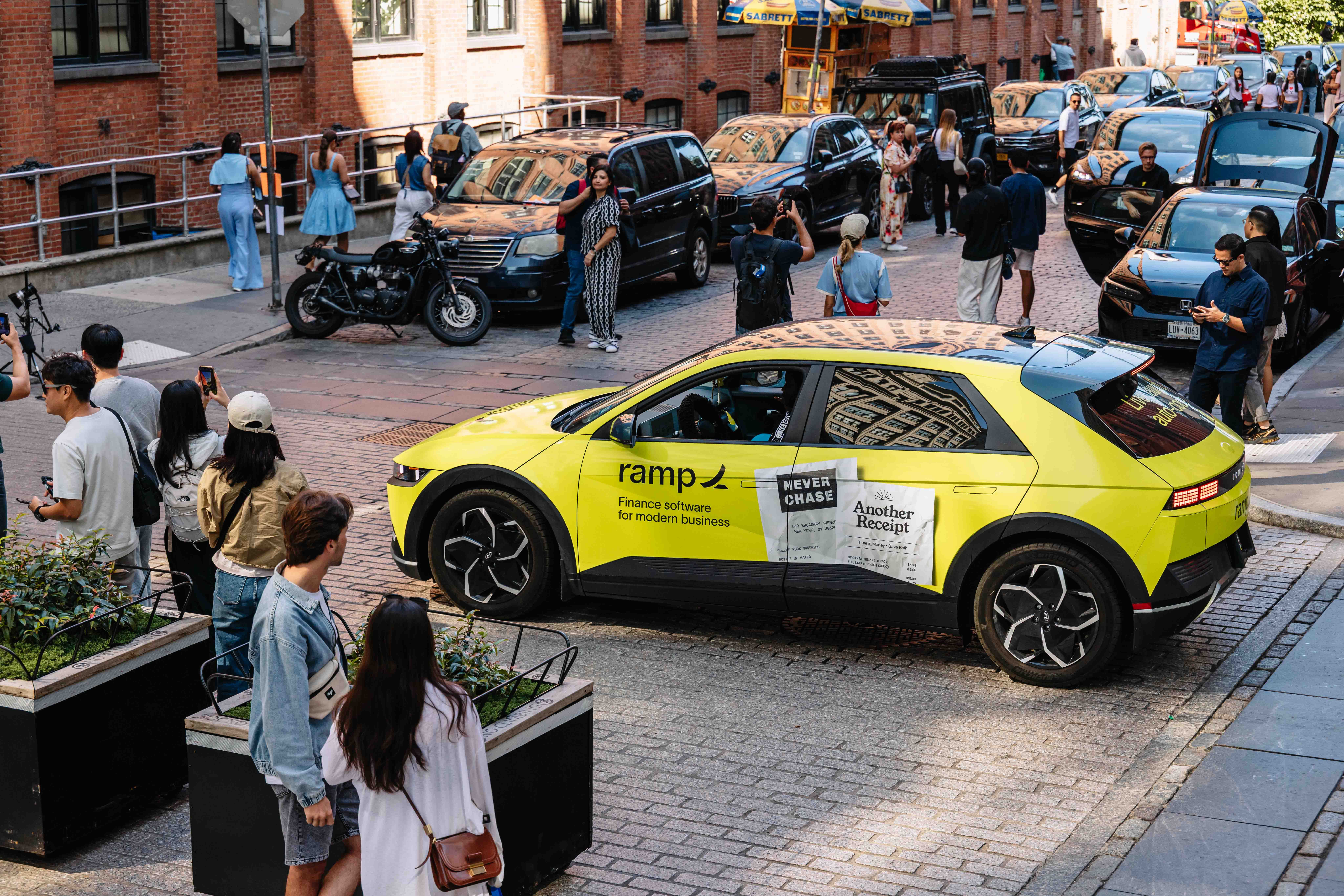 Wrapped car in for Ramp in Brooklyn with pedestrians staring 