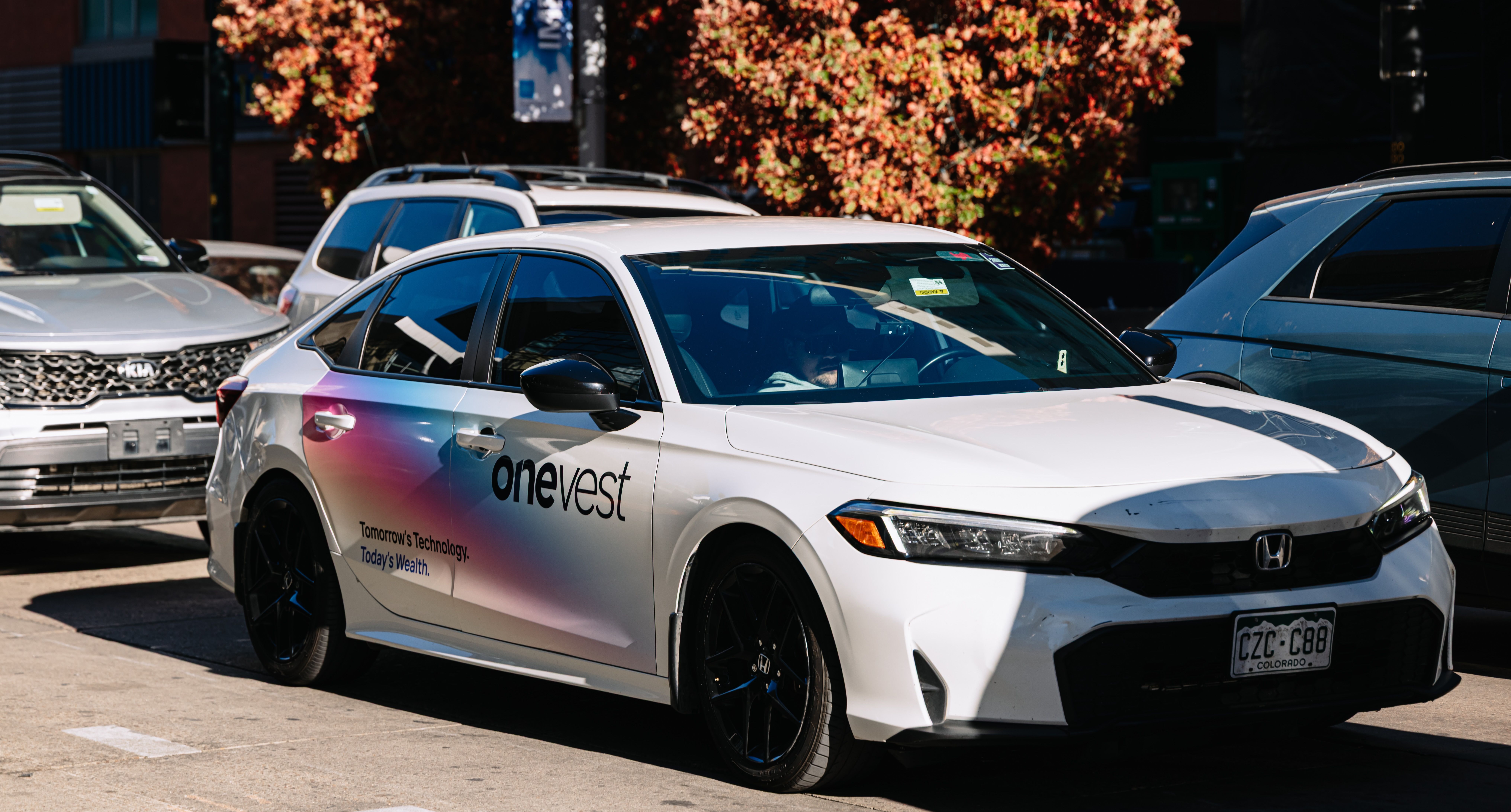 OneVest wrapped car OOH campaign in Denver via GOOD TRAFFIC