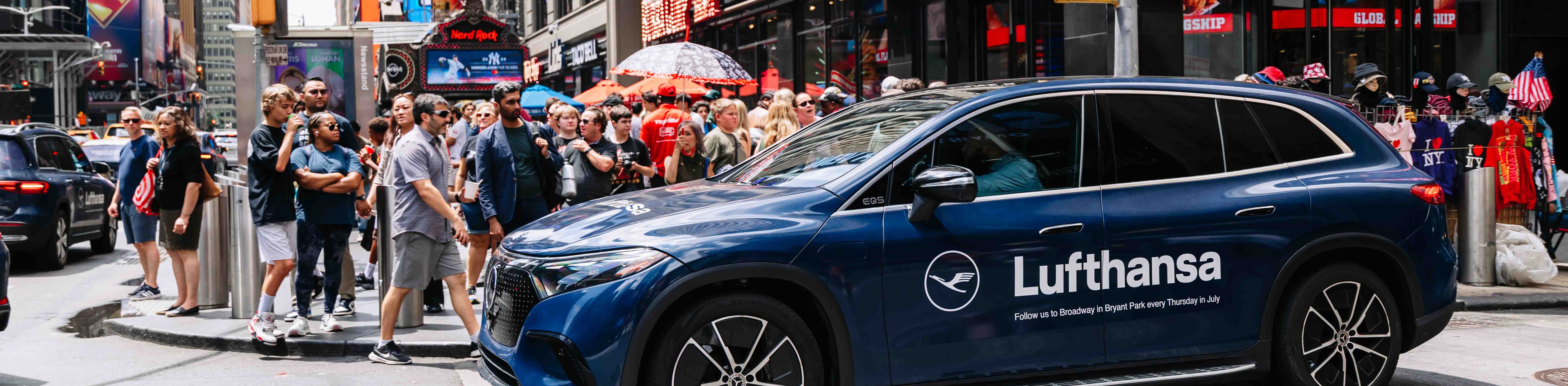 Netflix Senna-branded red Tesla Model Y fleet lined up on a rooftop with the Las Vegas Strip skyline in the background