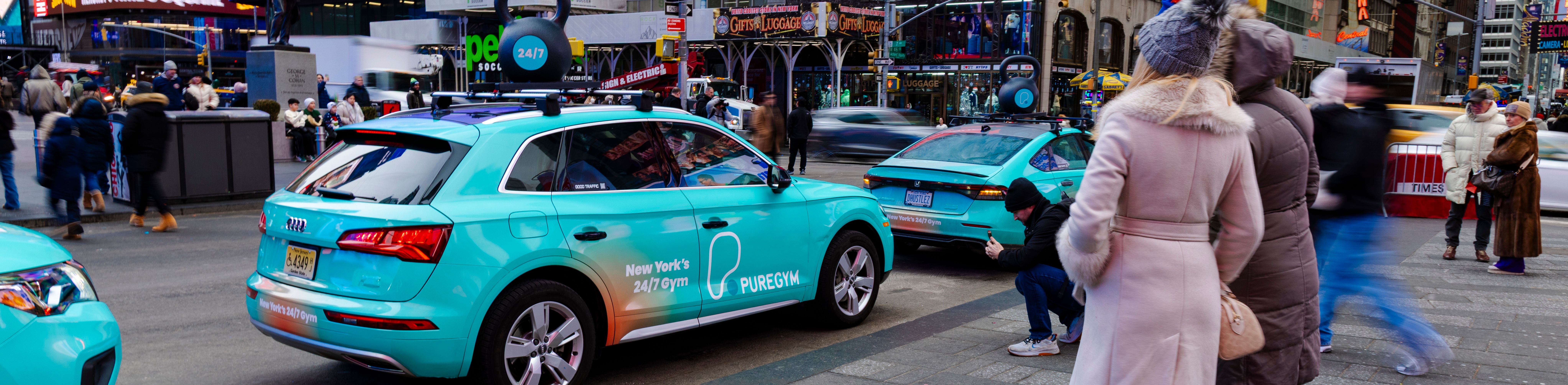 a fleet of wrapped rideshare vehicles 