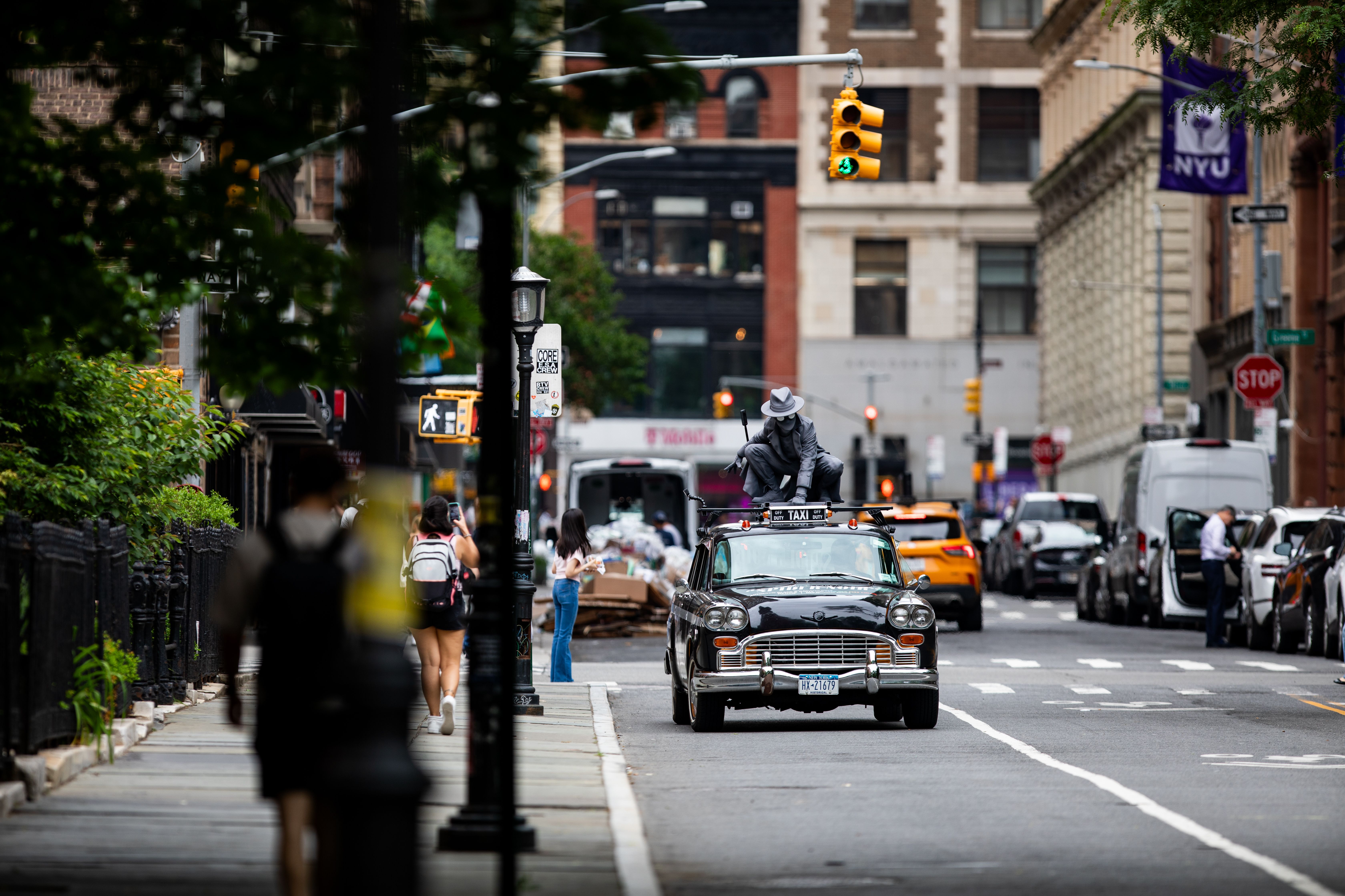 Wrapped specialty vehicle (vintage taxi) with prime video spidernoir 3D topper driving through NYC