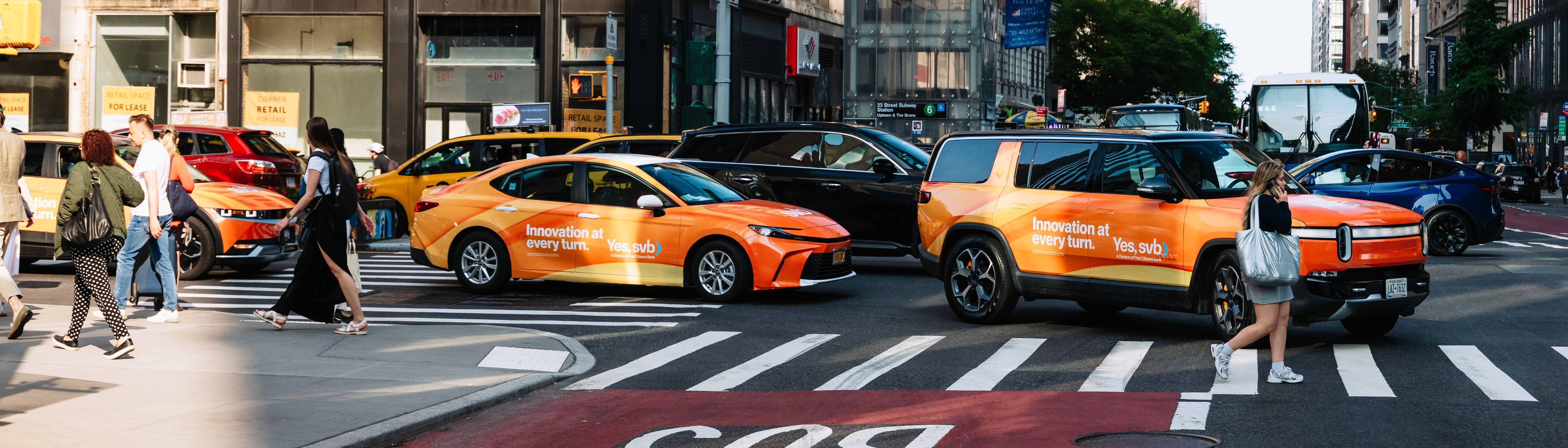a fleet of wrapped rideshare vehicles saturating a city