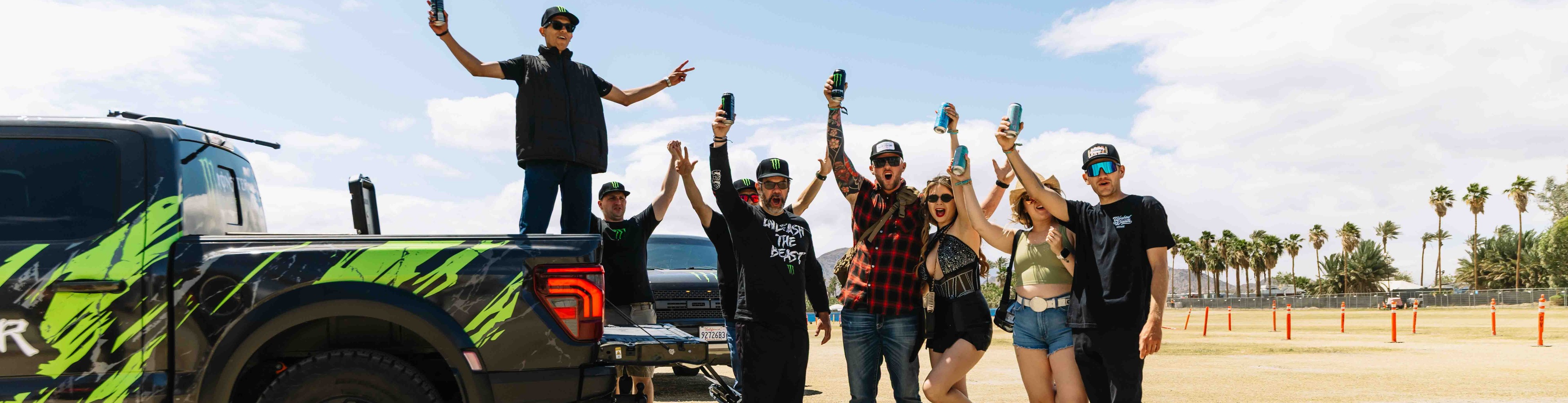 Monster Energy experiential ooh rideshare campaign with wrapped truck and customers enjoying free energy drinks