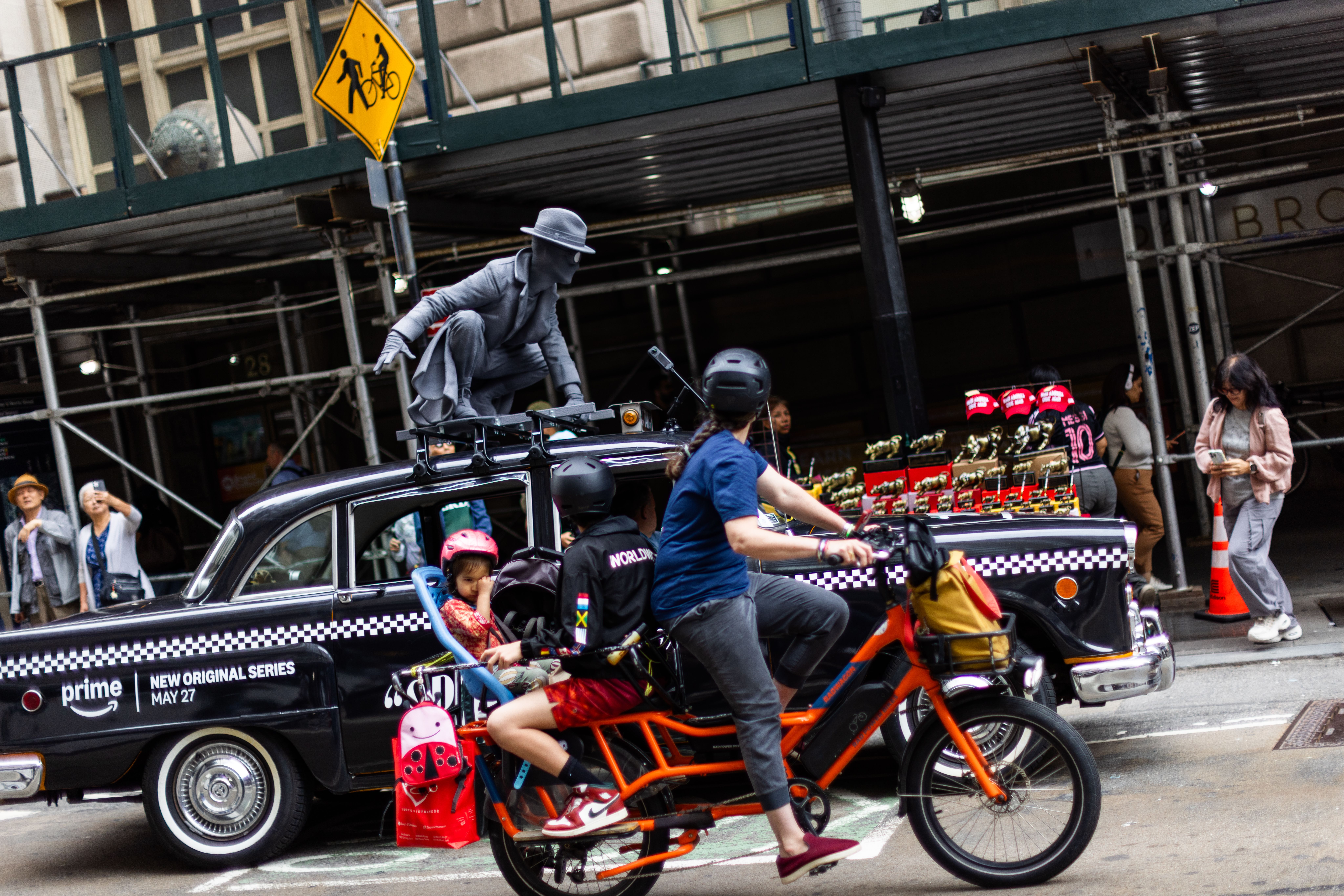 Wrapped specialty vehicle (vintage taxi) with prime video spidernoir 3D topper driving through NYC