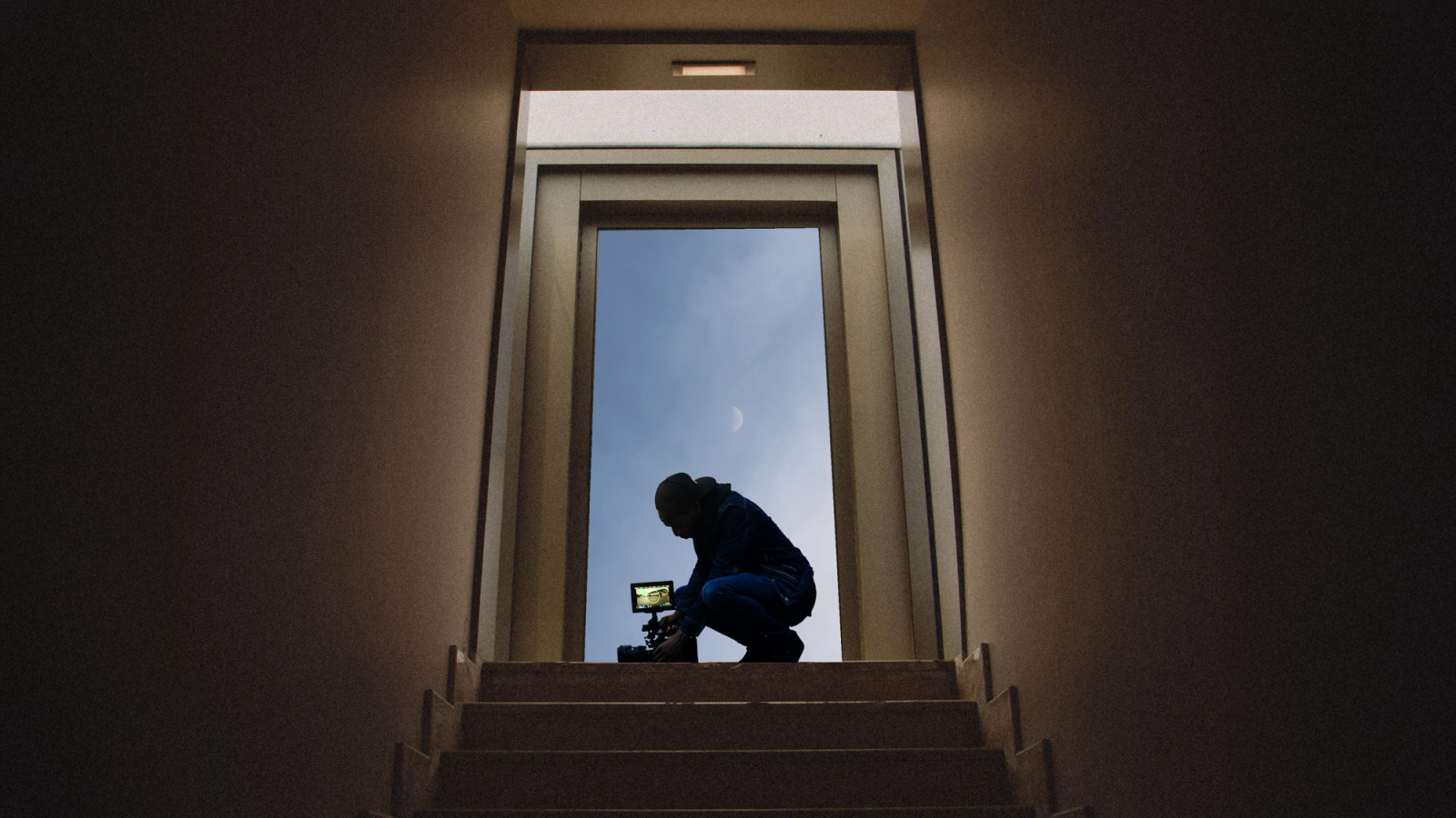 Filmmaker Silhouette in a Vertical Doorframe