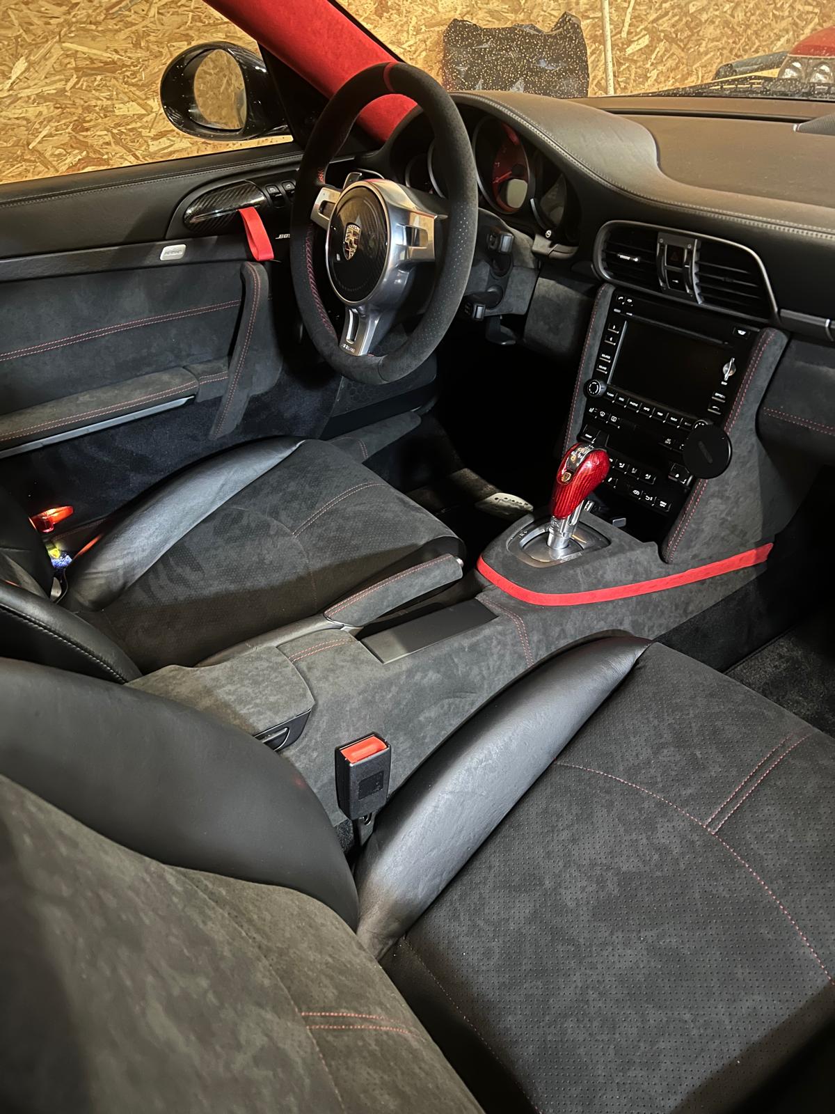 Restored automotive door panel and centre console by Sellerie du Parc