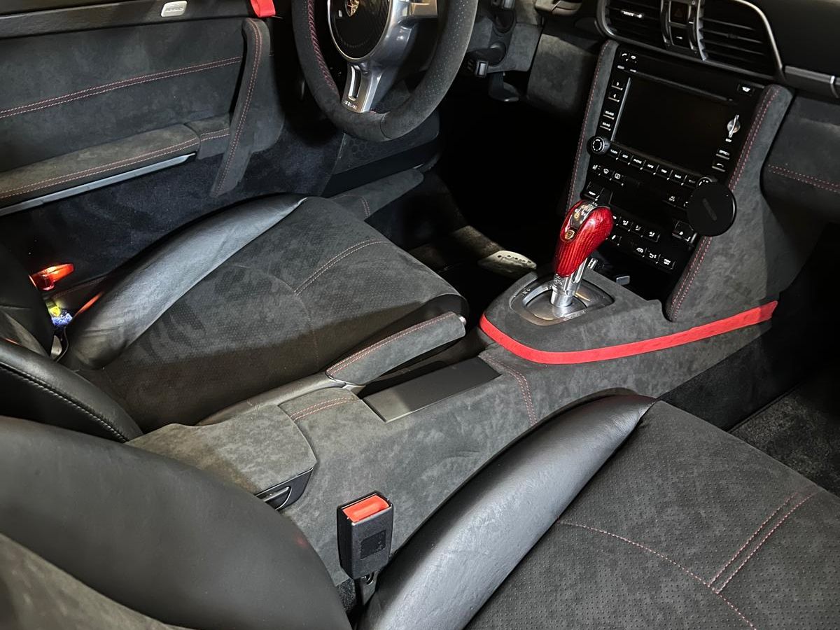 Restored automotive door panel and centre console by Sellerie du Parc
