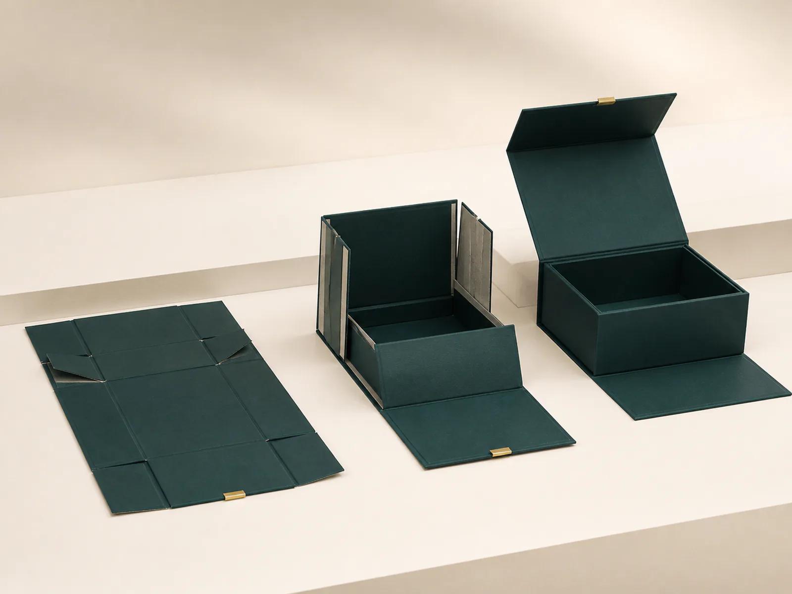 Fold-flat magnetic rigid box shown open and partially collapsed with clear hinge construction