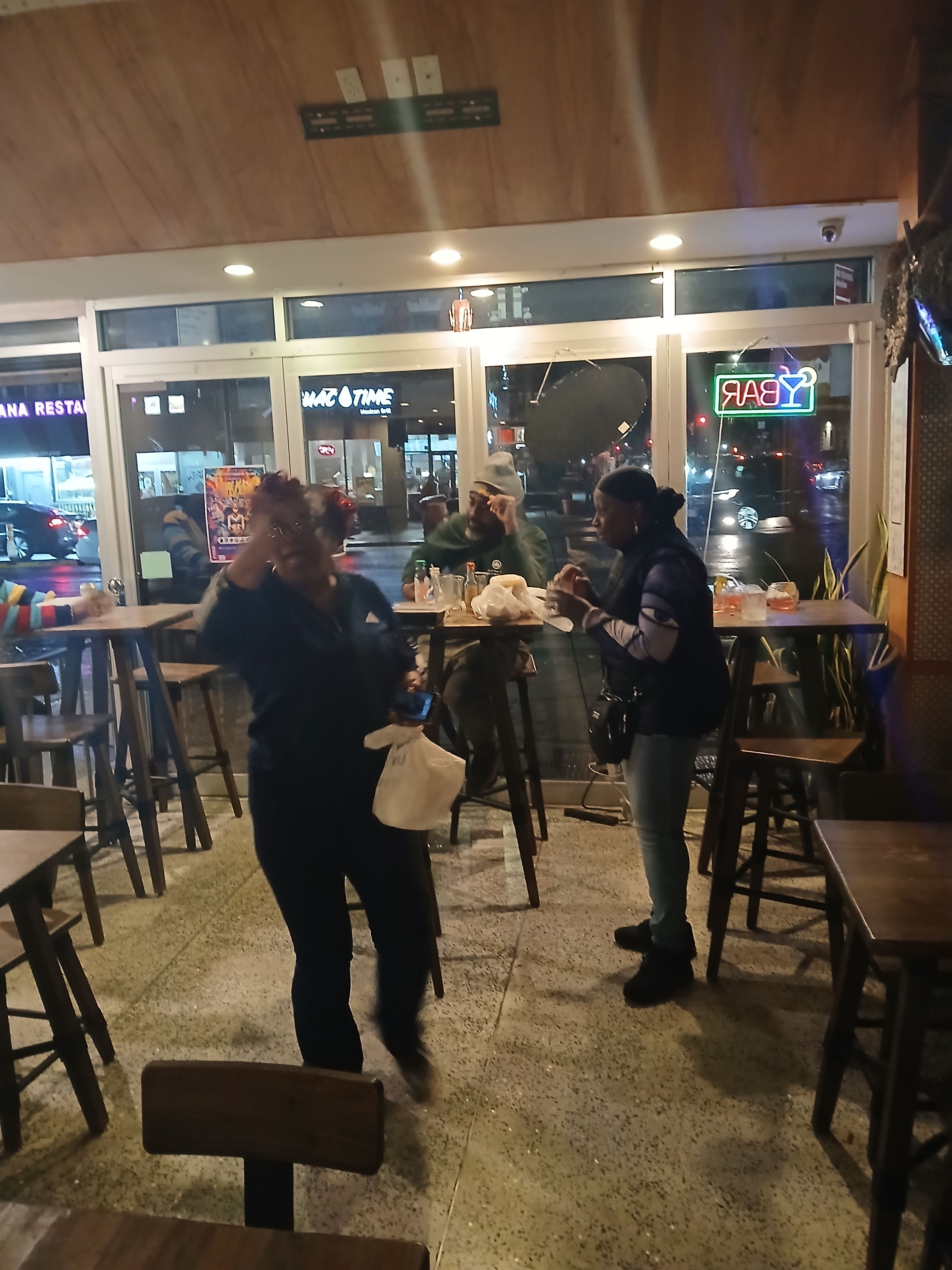  Customers dancing and socializing at Jus Fishy & Beyond, showcasing the vibrant community and soul of the islands on Flatbush Ave Brooklyn.