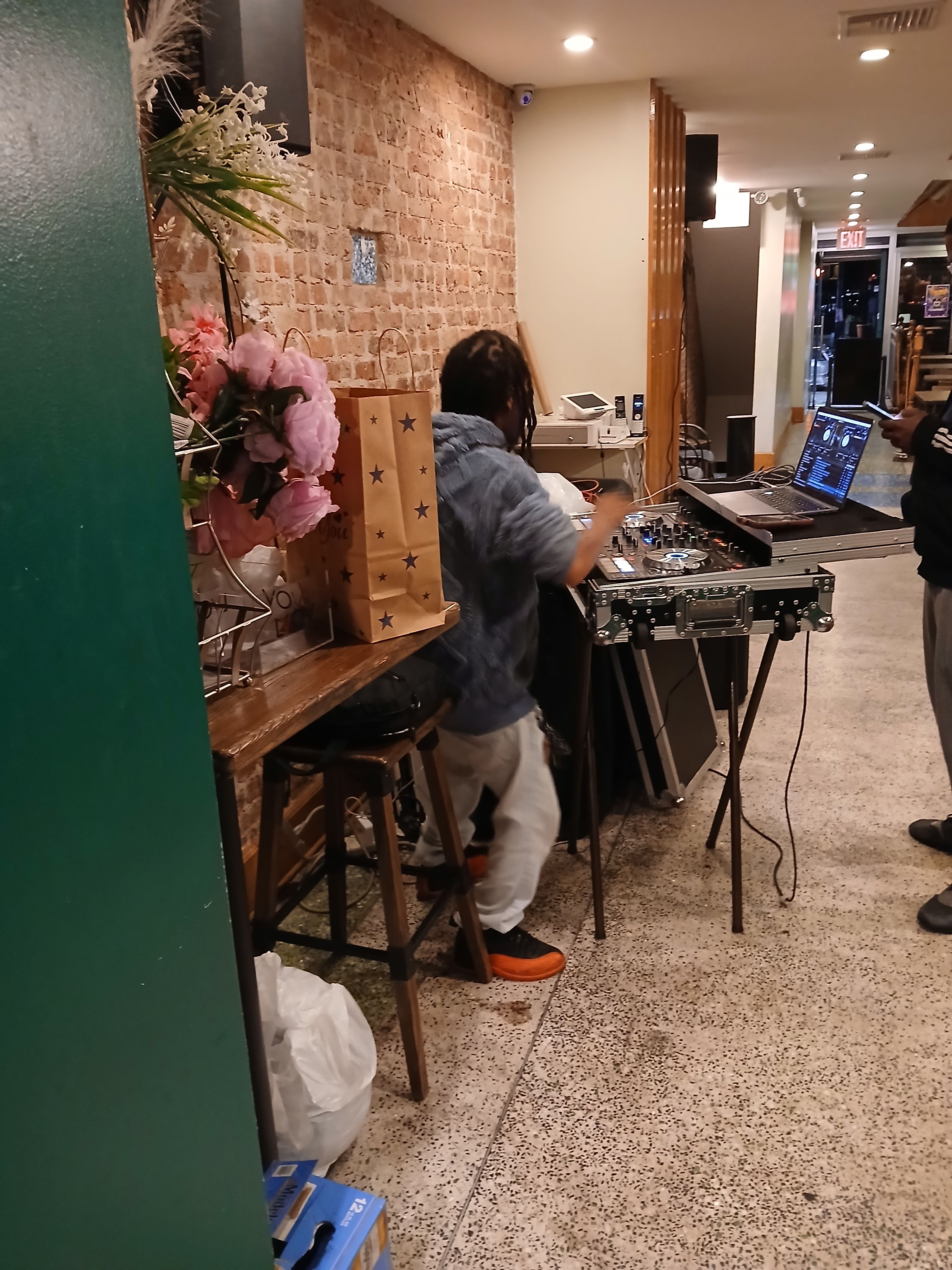 A live DJ performing at Jus Fishy & Beyond, providing high-energy music and entertainment for our Brooklyn nightlife guests music by dj monsta .