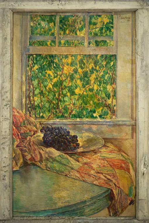 Painting of a quilt draped on a tabletop in front of window