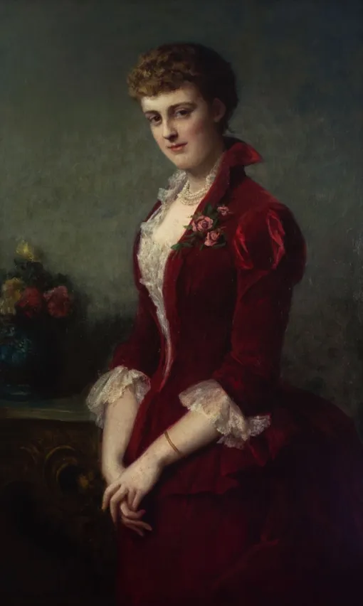 Painting of a standing woman shown wearing a red velvet dress with white lace details. She looks directly at the viewer with a slight smile and holds her hands clasped together in front of her. 