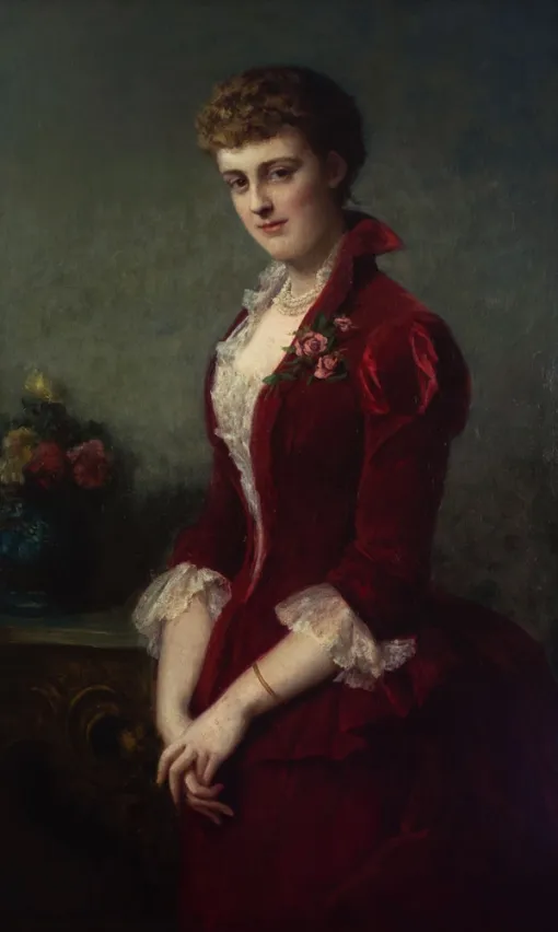 Painting of a standing woman shown wearing a red velvet dress with white lace details. She looks directly at the viewer with a slight smile and holds her hands clasped together in front of her.