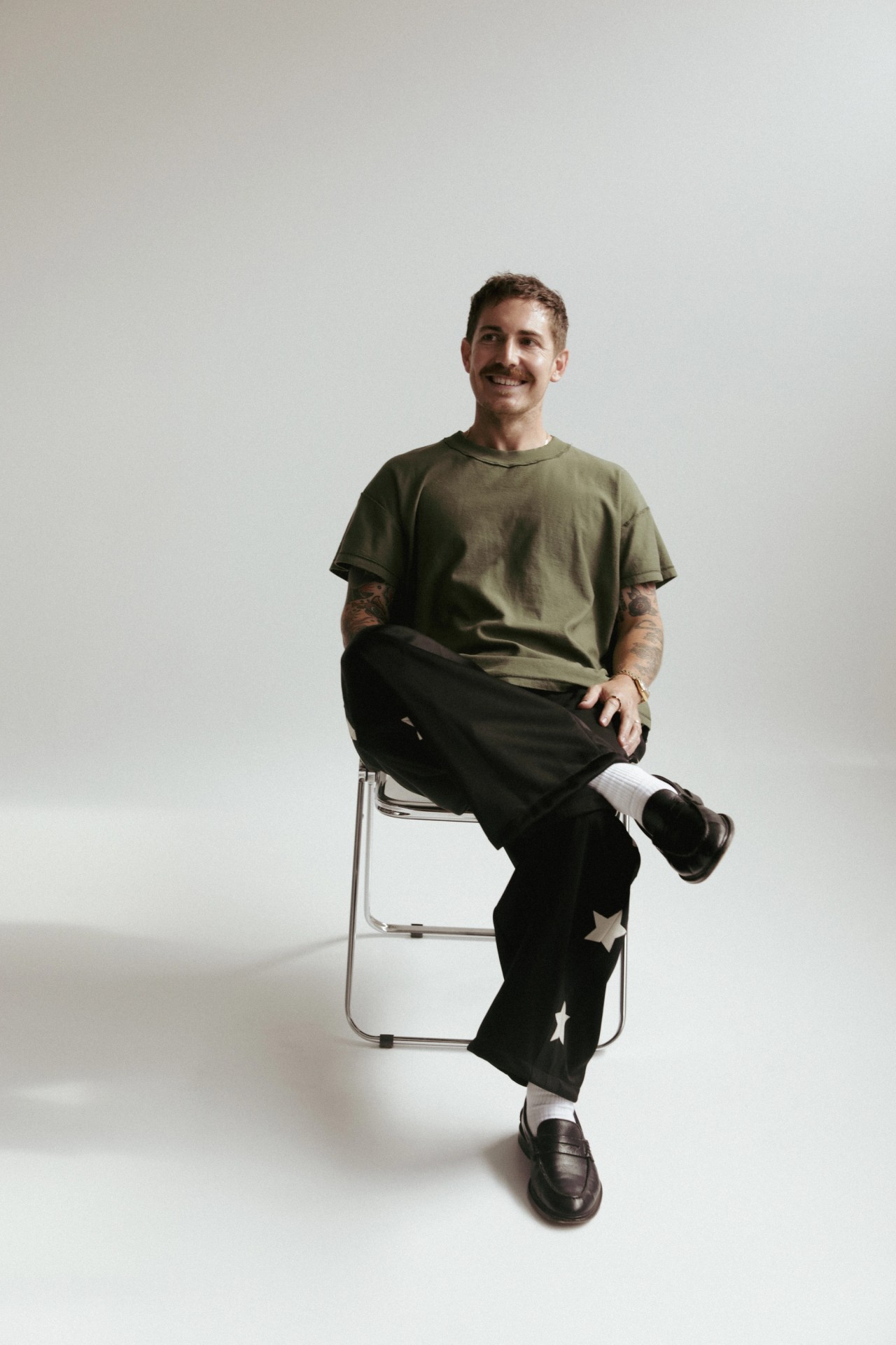 Mitchell Jones sitting on a chair