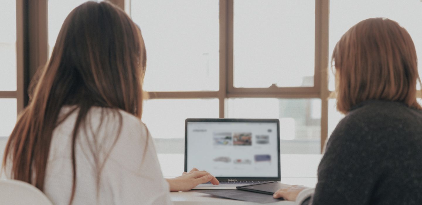 2 women working on a computer