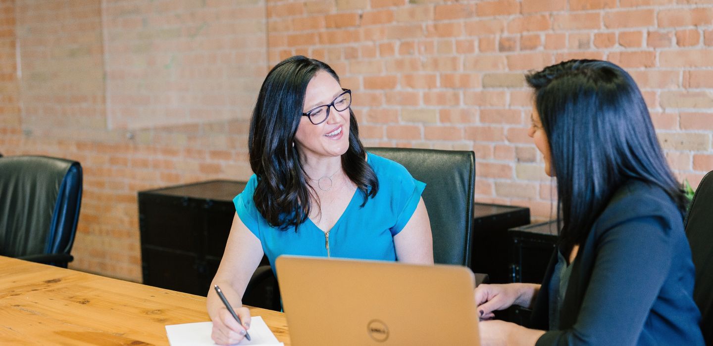 2 women in a working environment