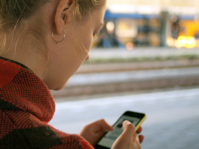 A woman looking at her phone