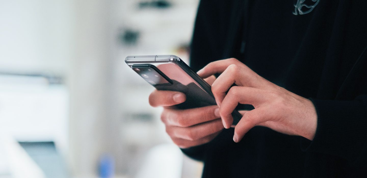 Hands holding a smartphone