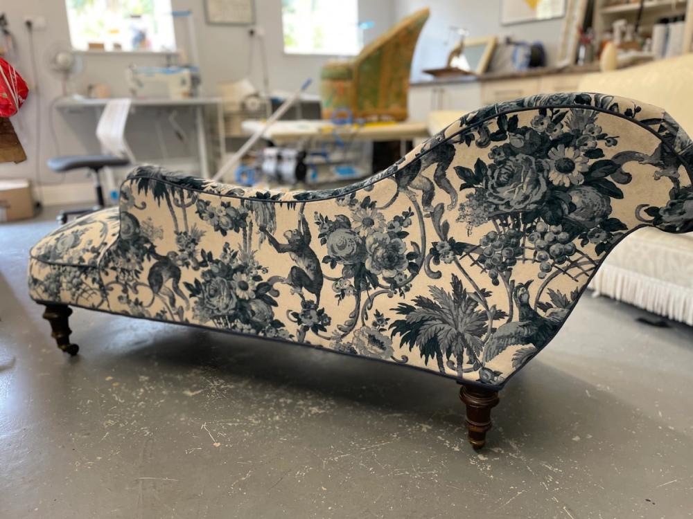 Rear view of chaise longue in dark blue and white floral velvet