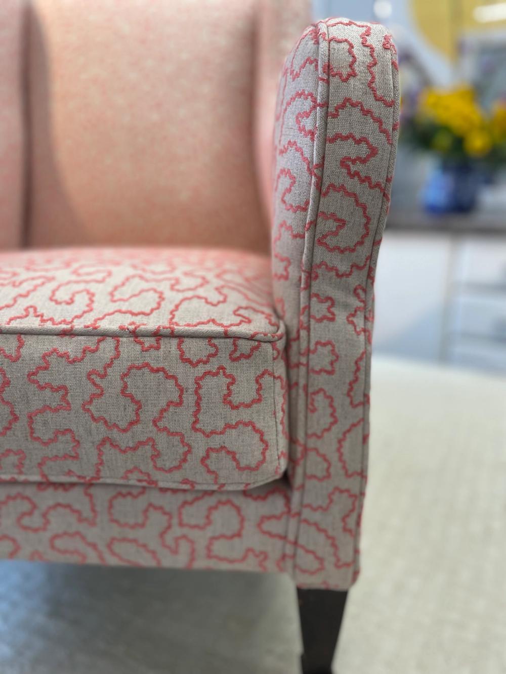 Up close detail of piping and box cushion on modern armchair 