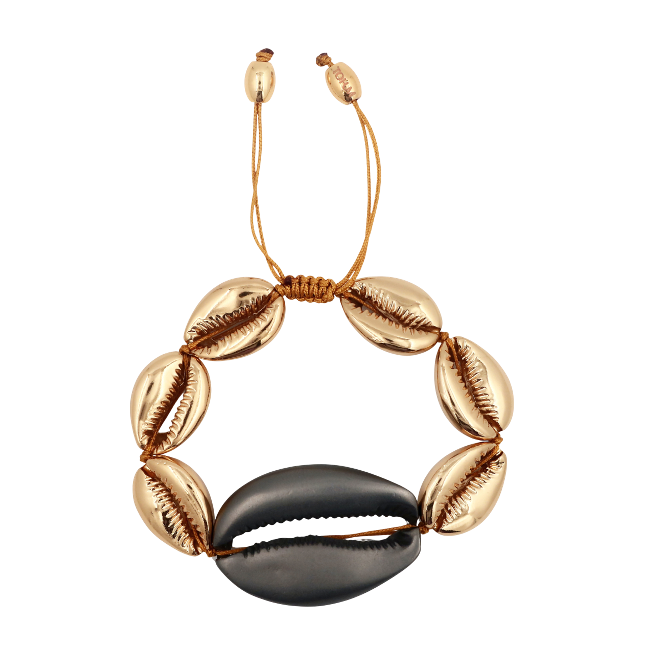 A gold shell bracelet with one large black shell in the centre