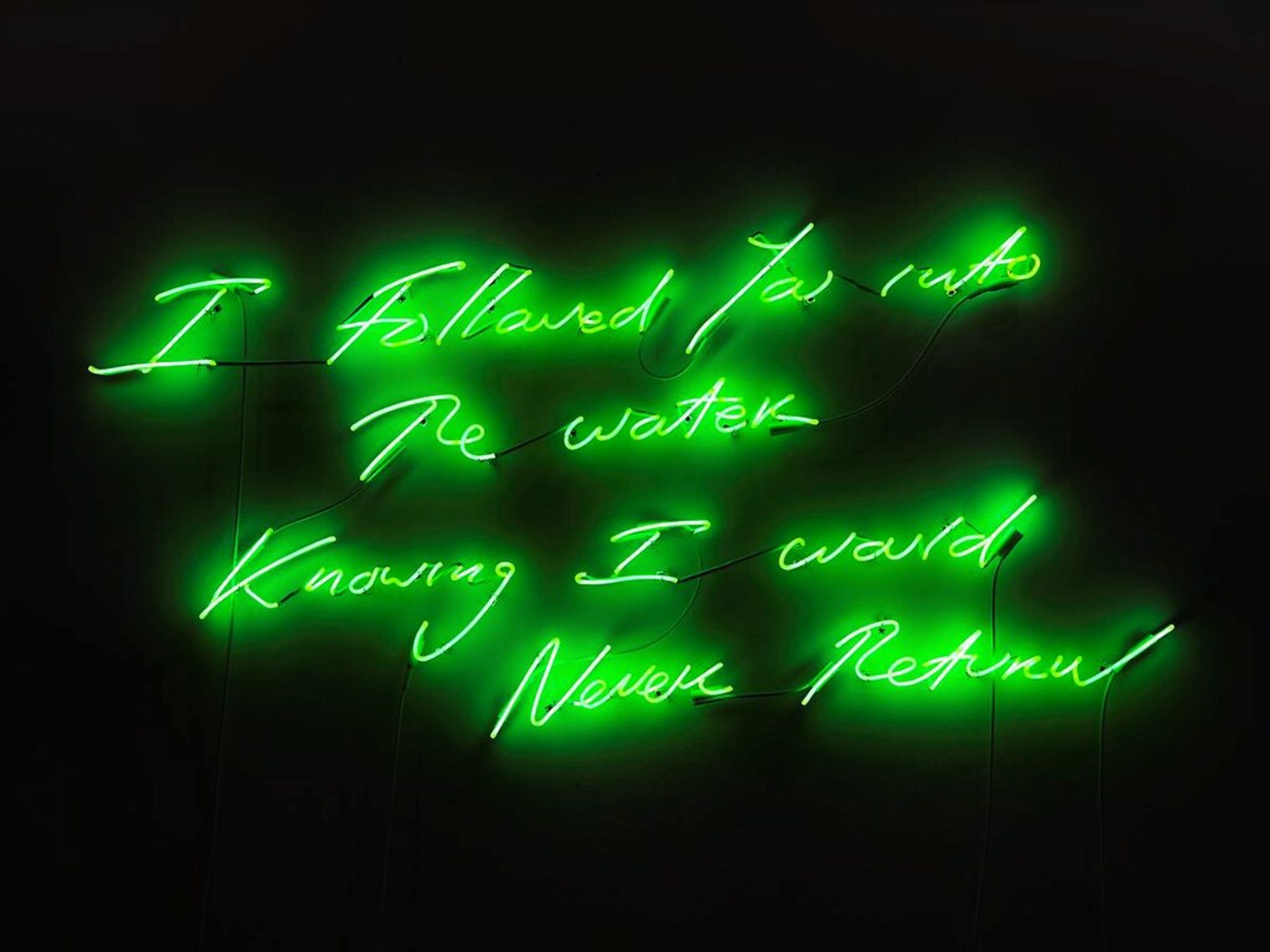 green neon writing on a wall