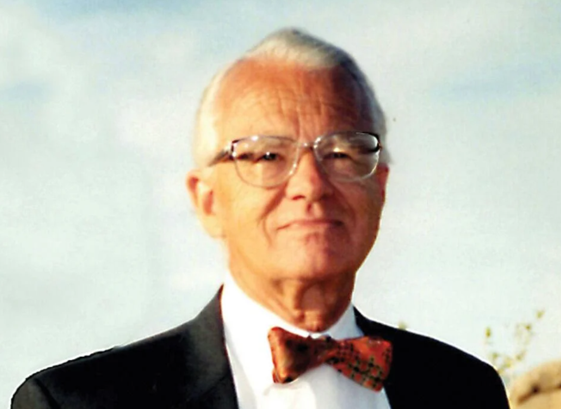 man with glasses and bow tie