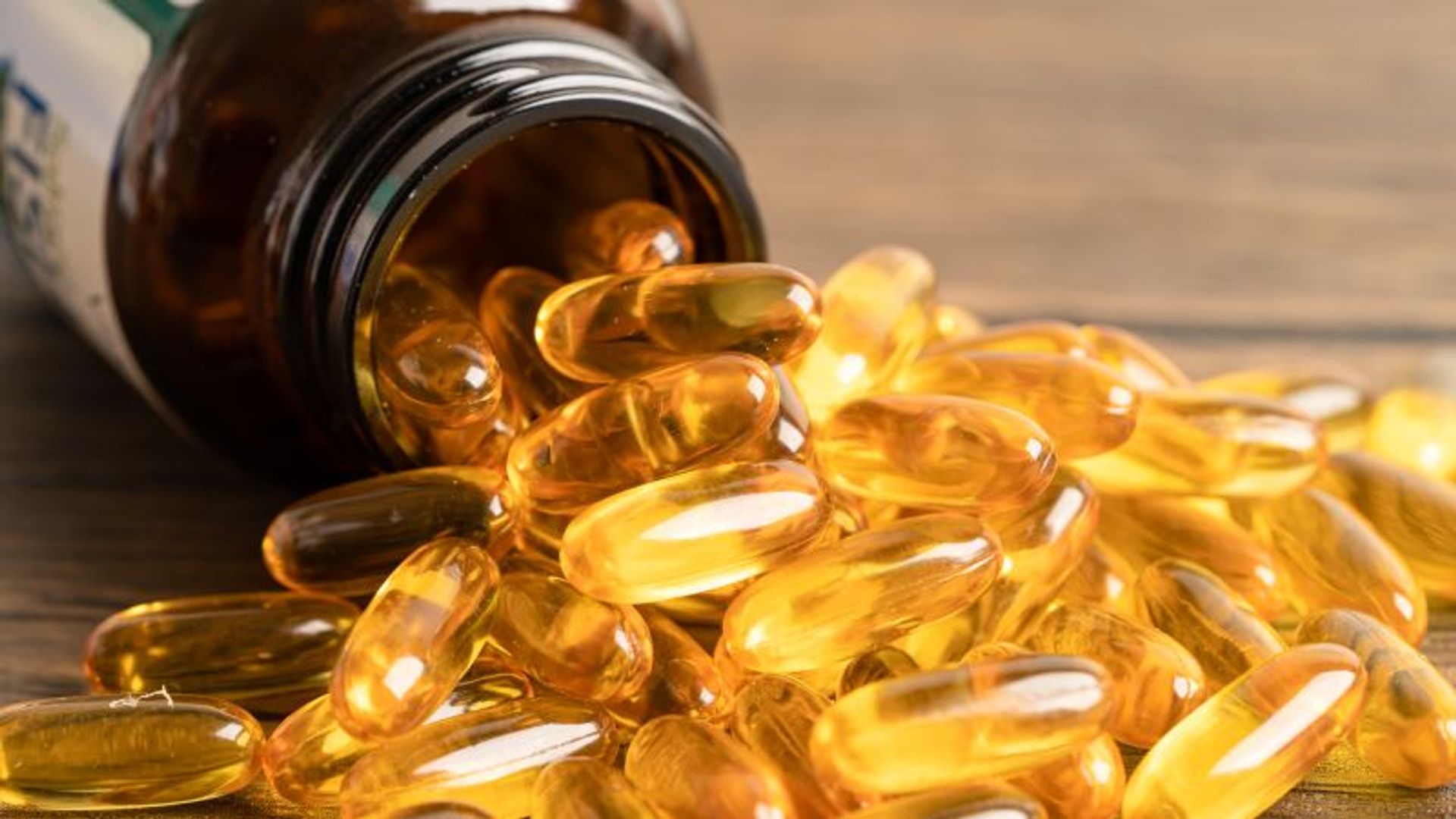 Fish oil supplements, bottle, spilling out