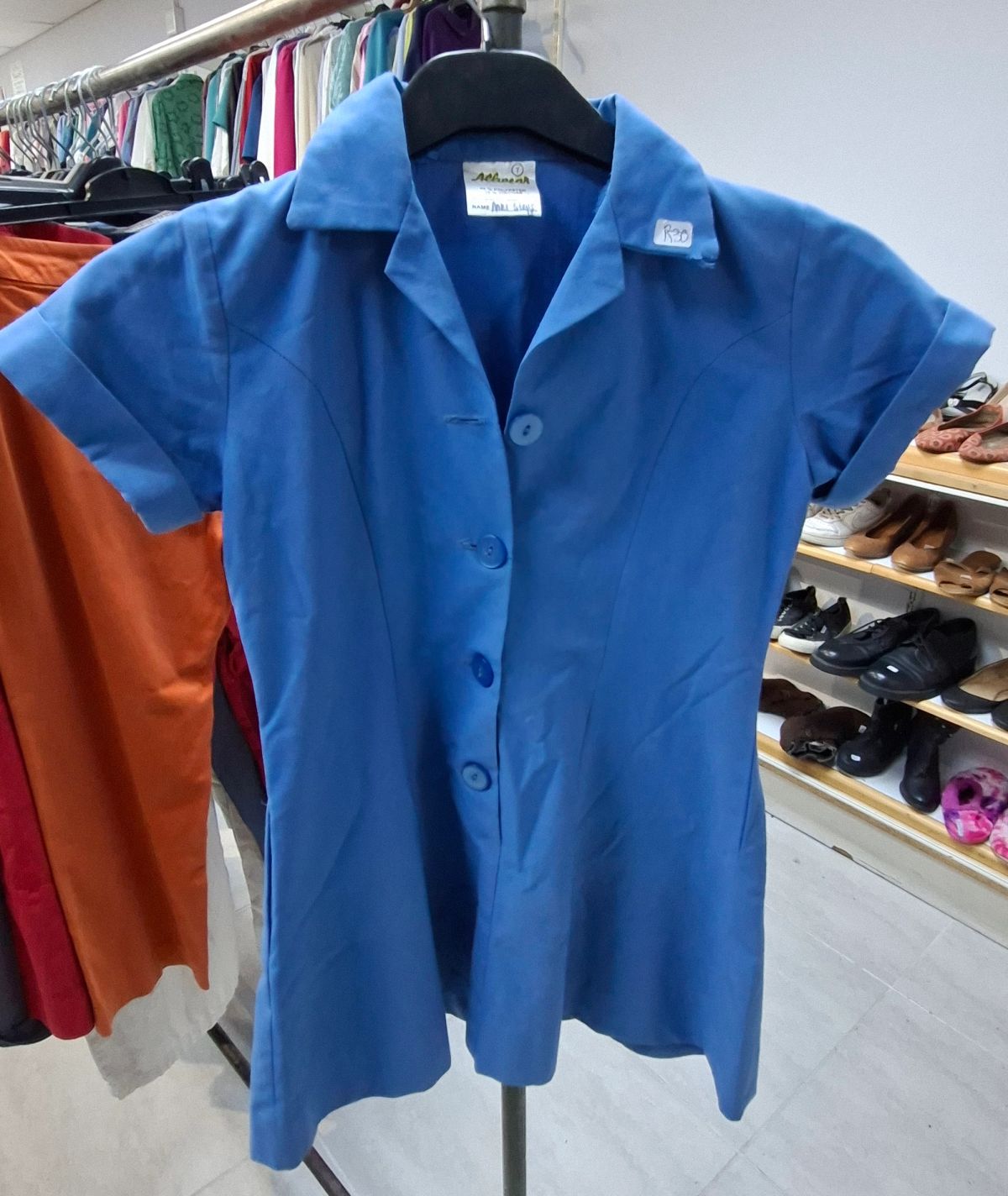 Various sizes and styles of girls’ school uniforms 9