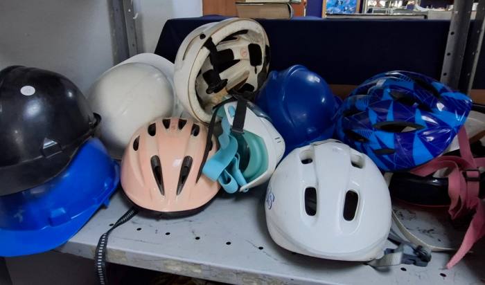 Variety of Bicycle Helmets and Hard Hats