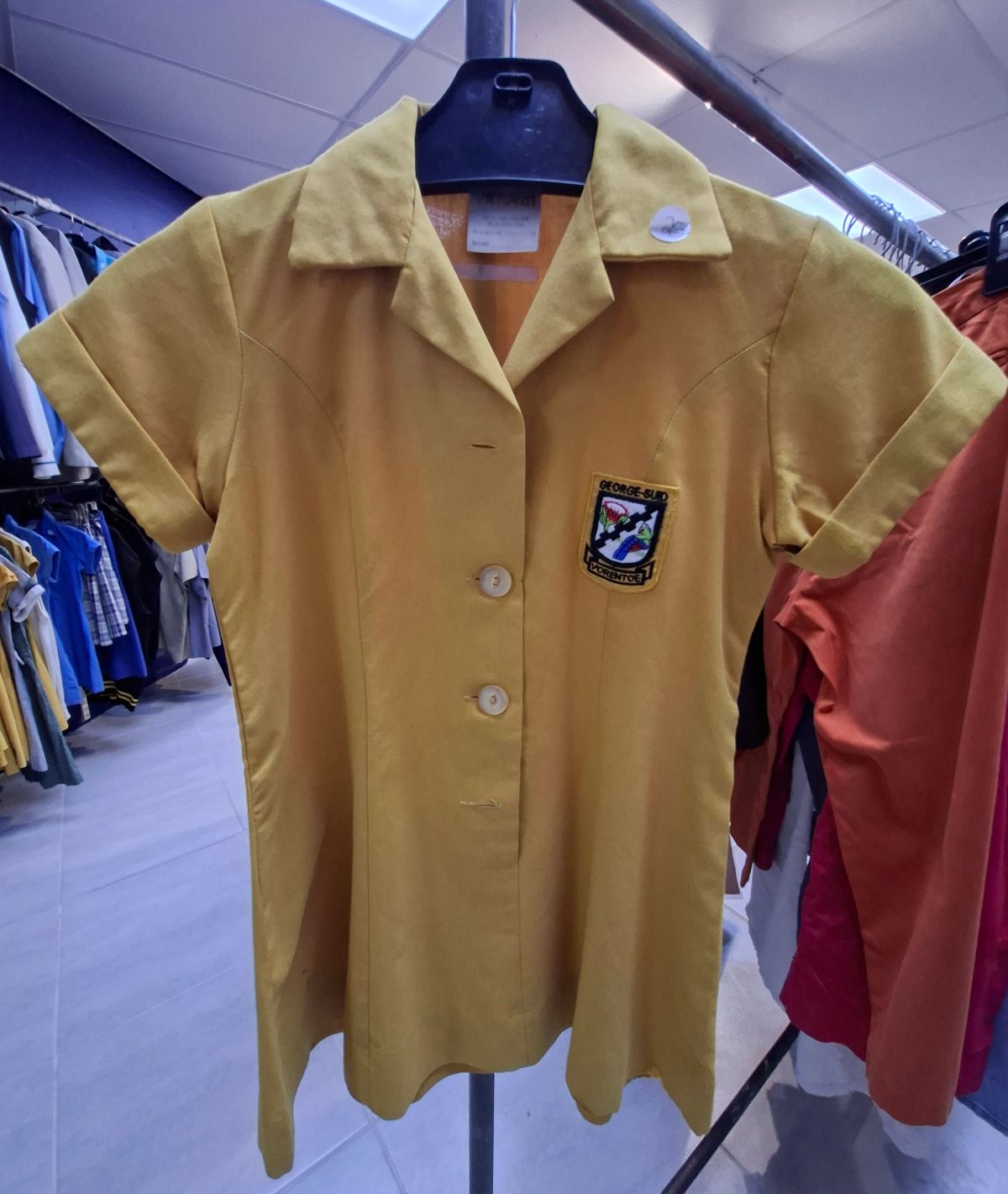 Various sizes and styles of girls’ school uniforms