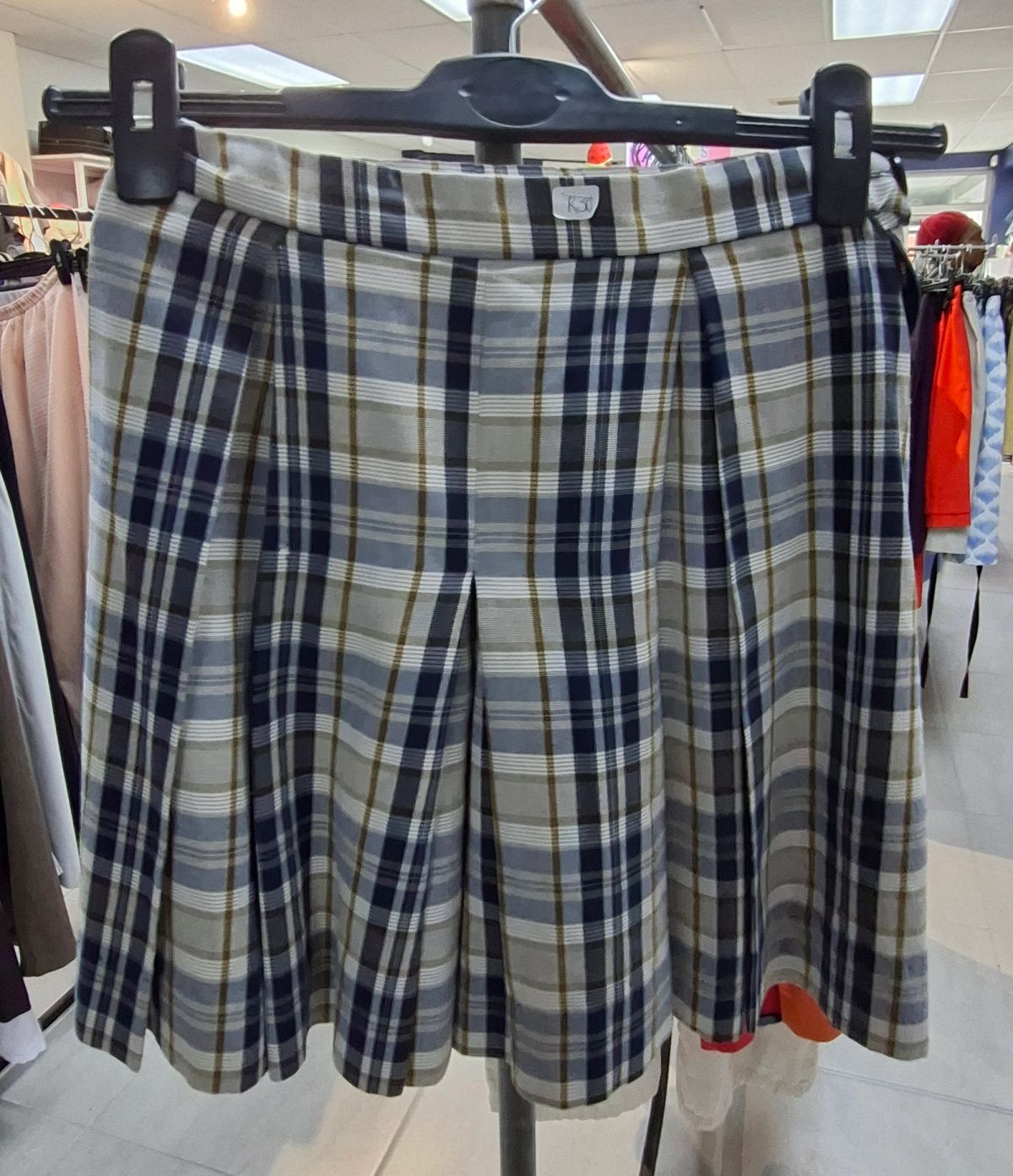 Various sizes and styles of girls’ school uniforms 12