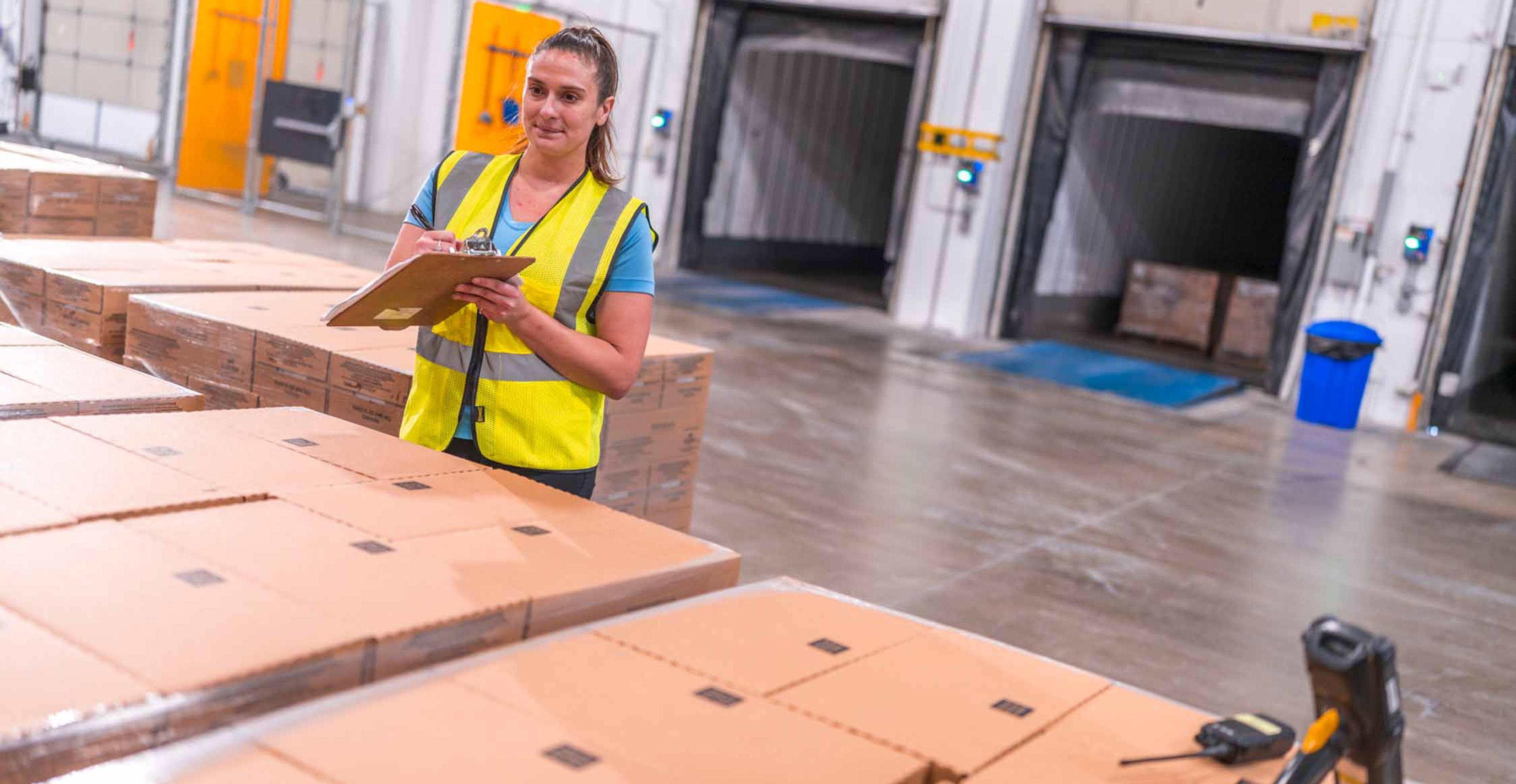 employee double checking cargo before it's loaded into the trailers