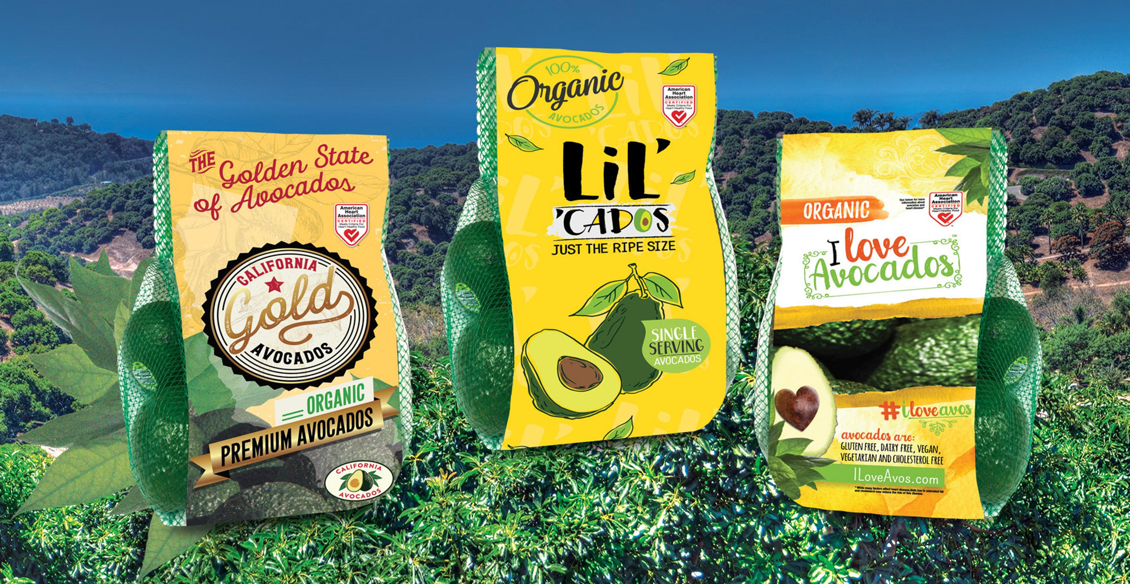 Three bags of avocados with an avocado farm in the background