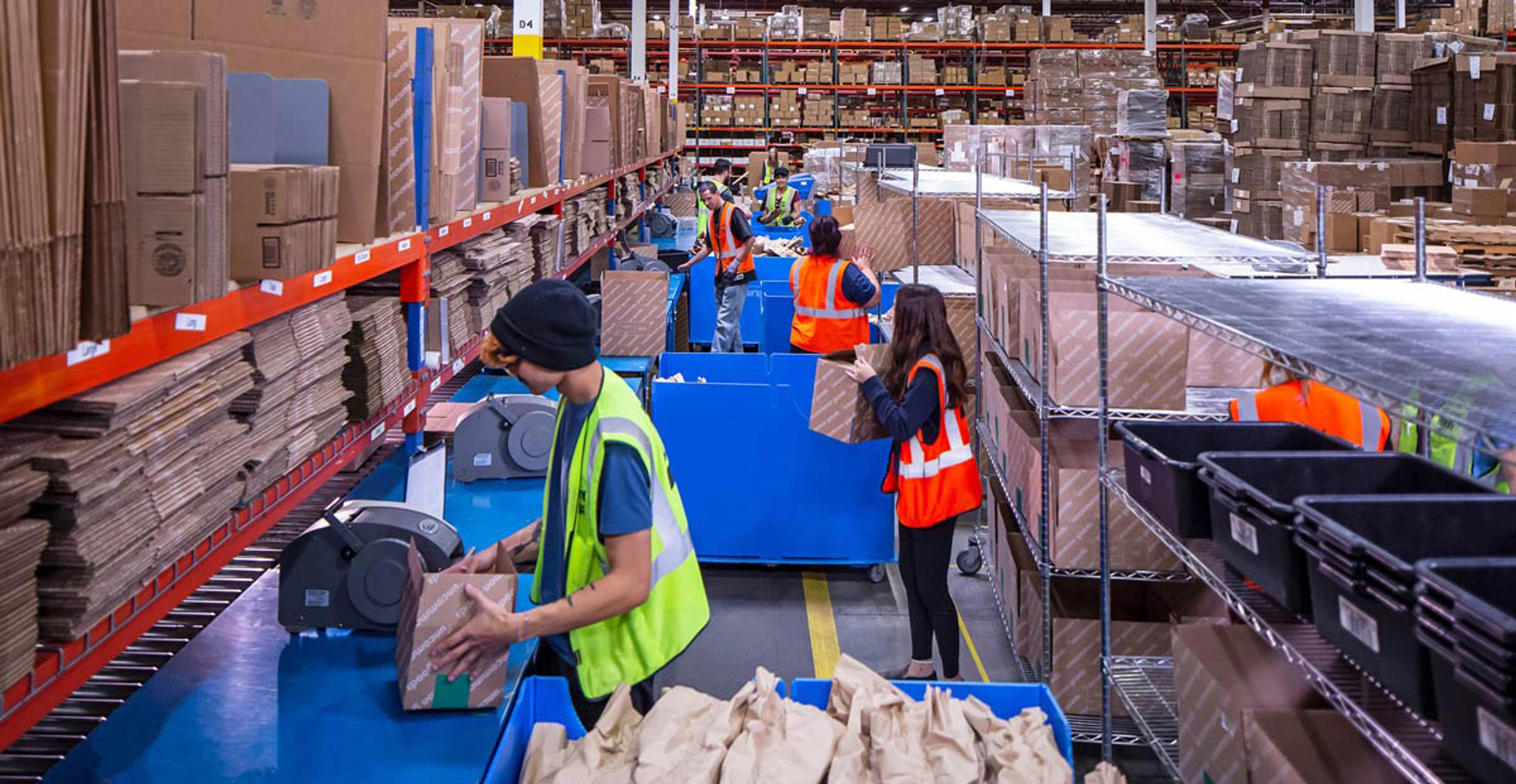 employees in warehouse planning for peak season