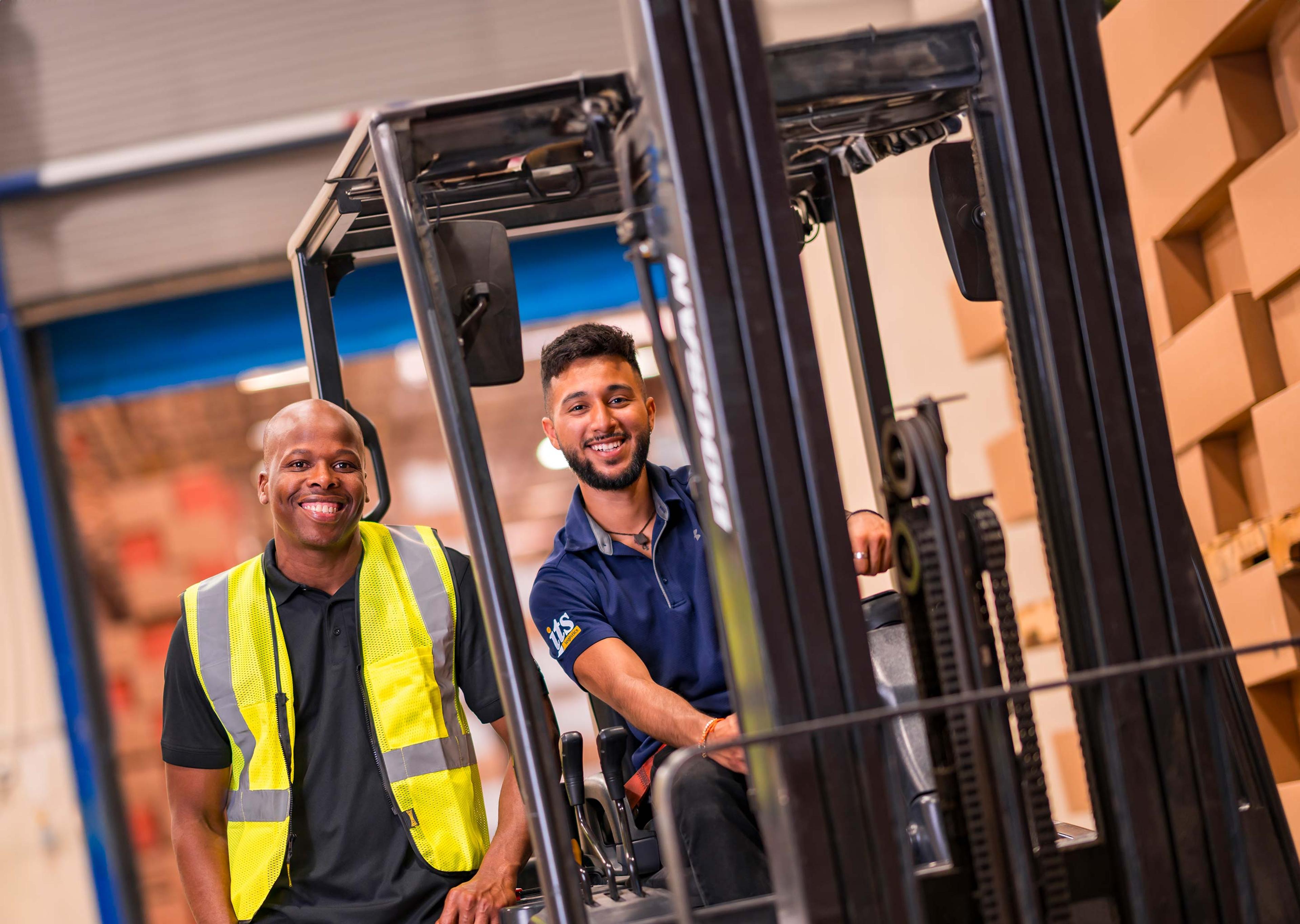 warehouse worker driving a forklift