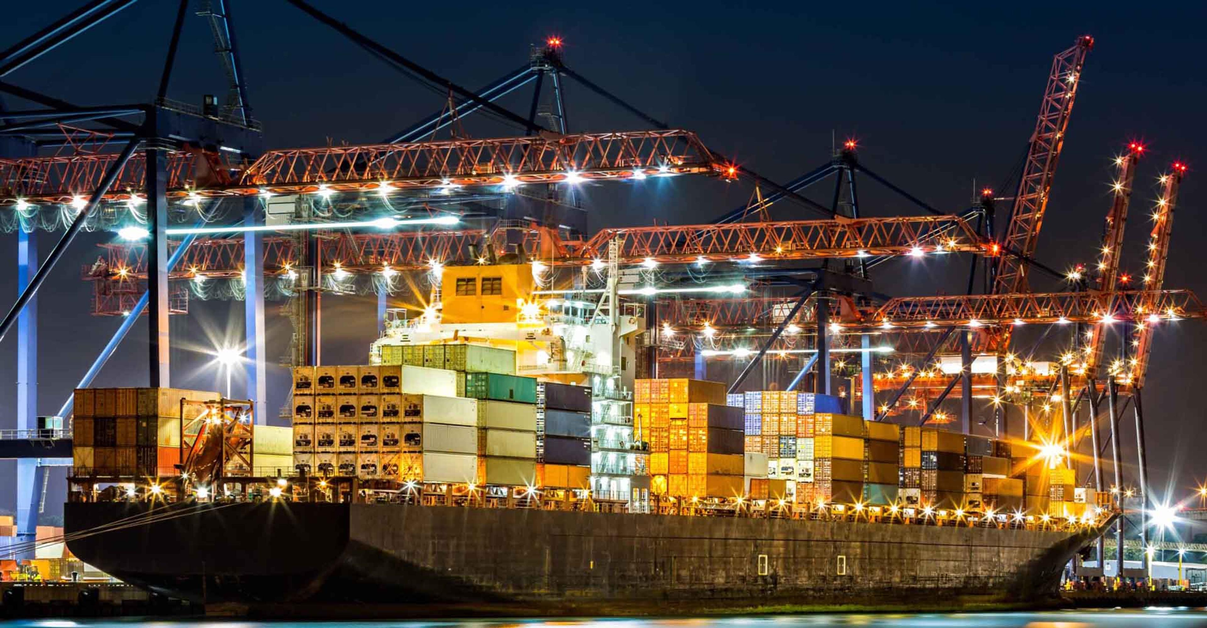 A loaded barge docked at a terminal
