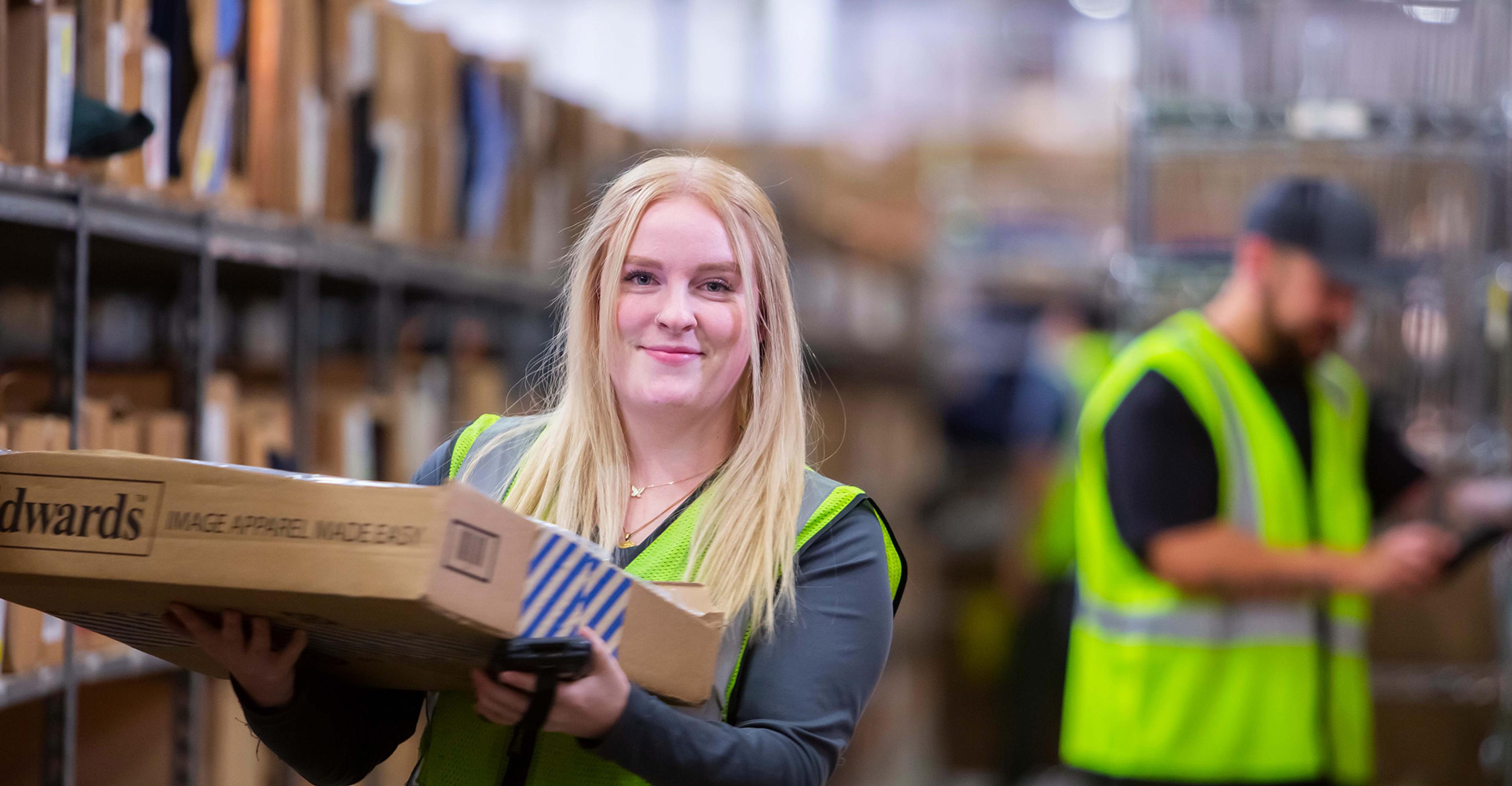 An ITS employee working in a warehouse
