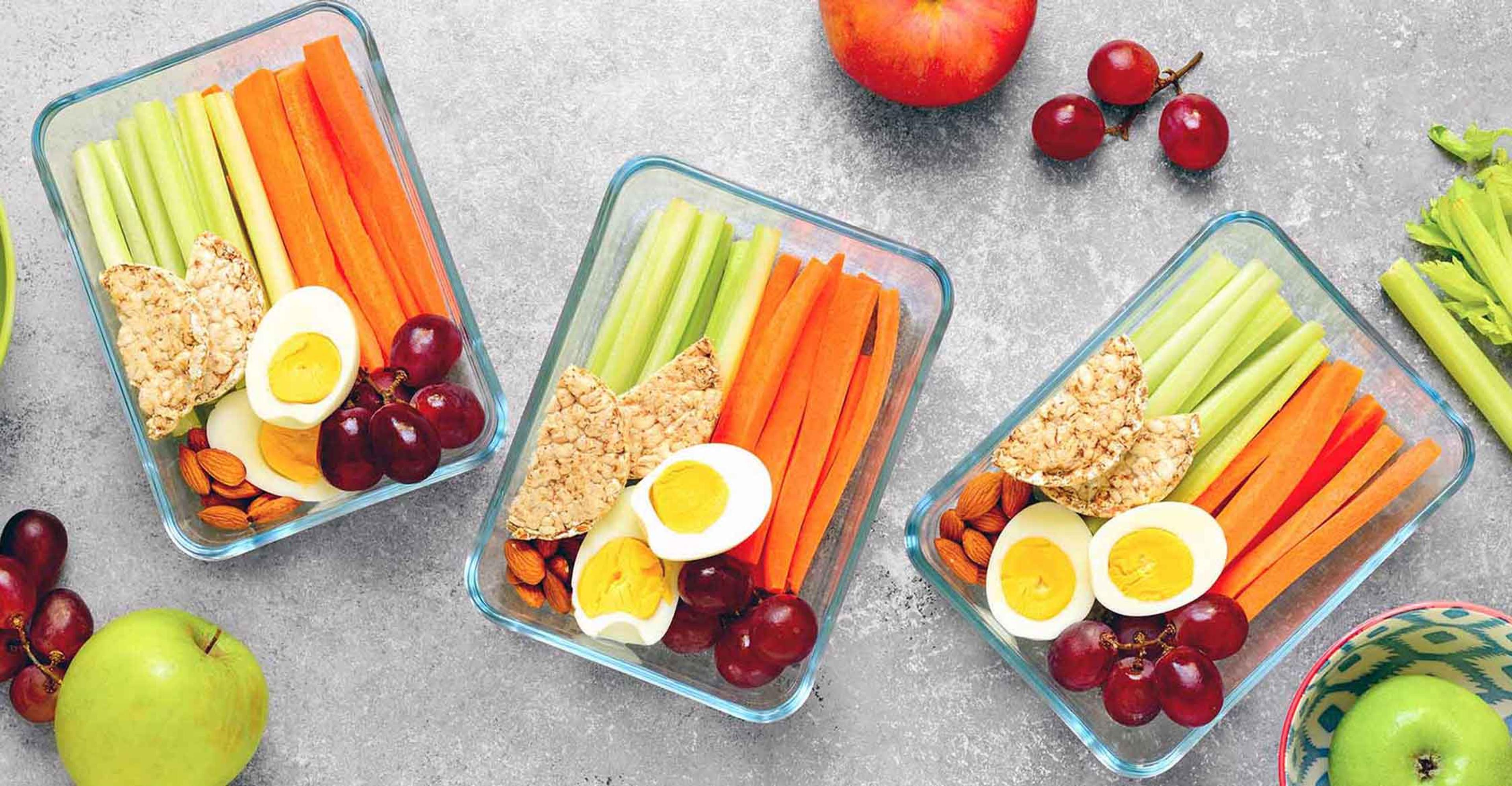 A healthy pair of sandwiches in a metal lunch pail