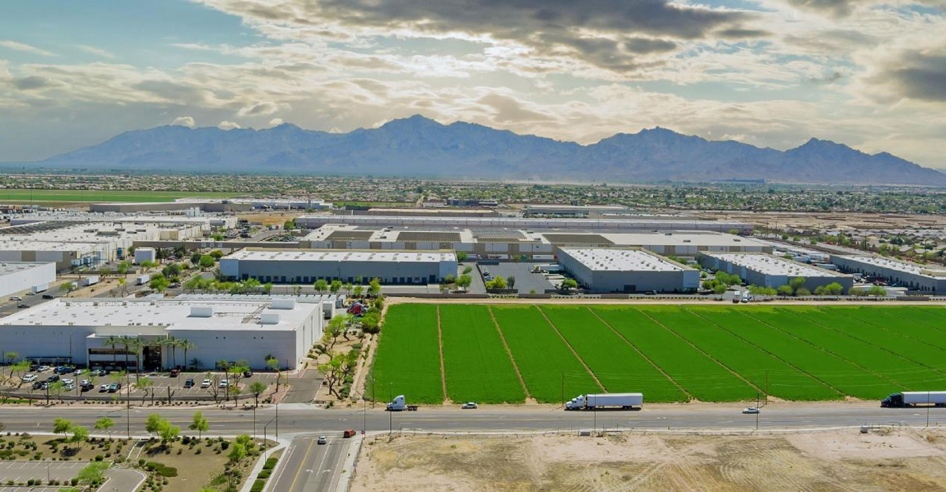 An aerial shot of distribution centers set against a skyline